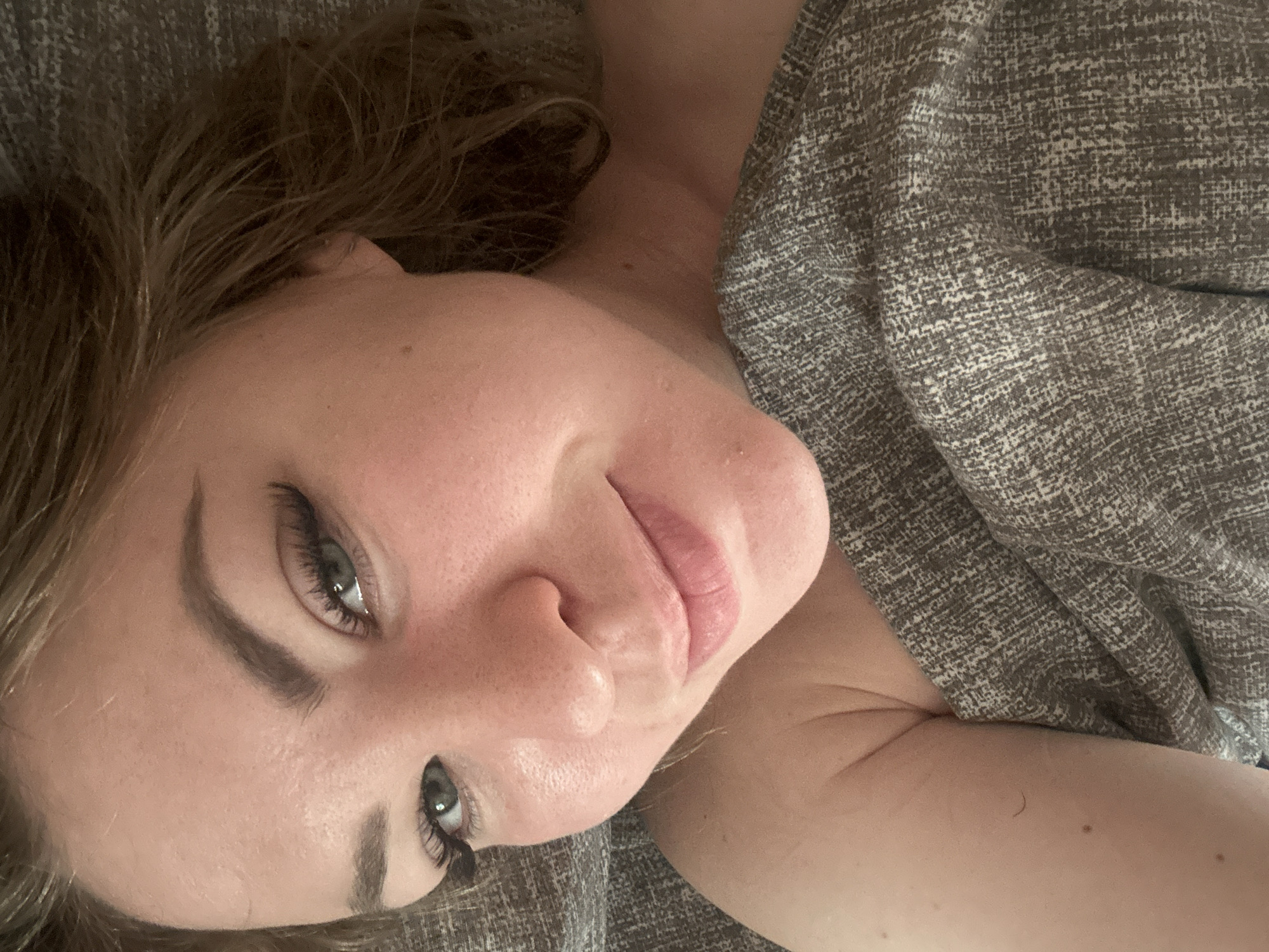 Woman photographed lying down in two sequential images