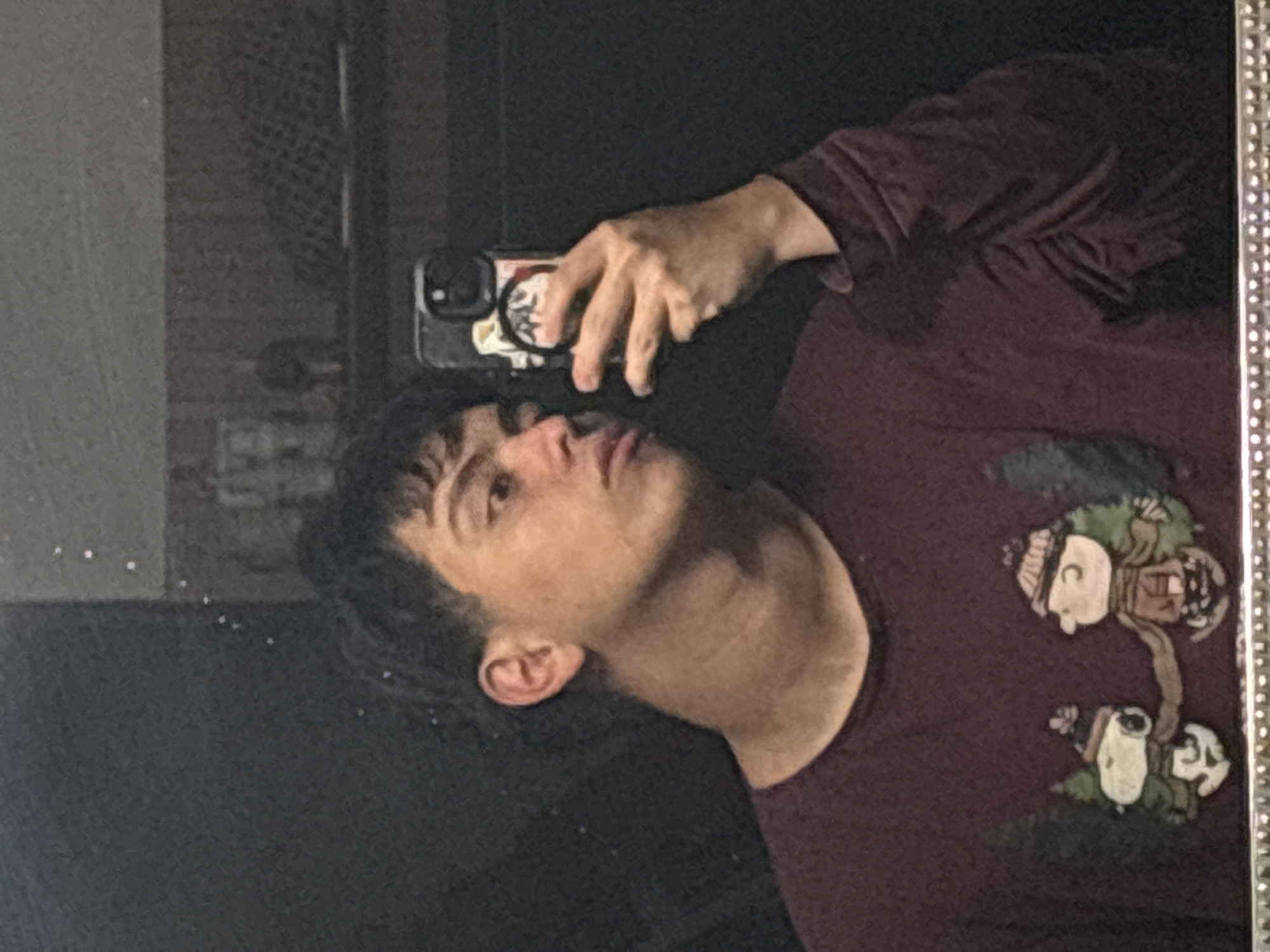 Back-to-back selfies in a dim Mexico City room