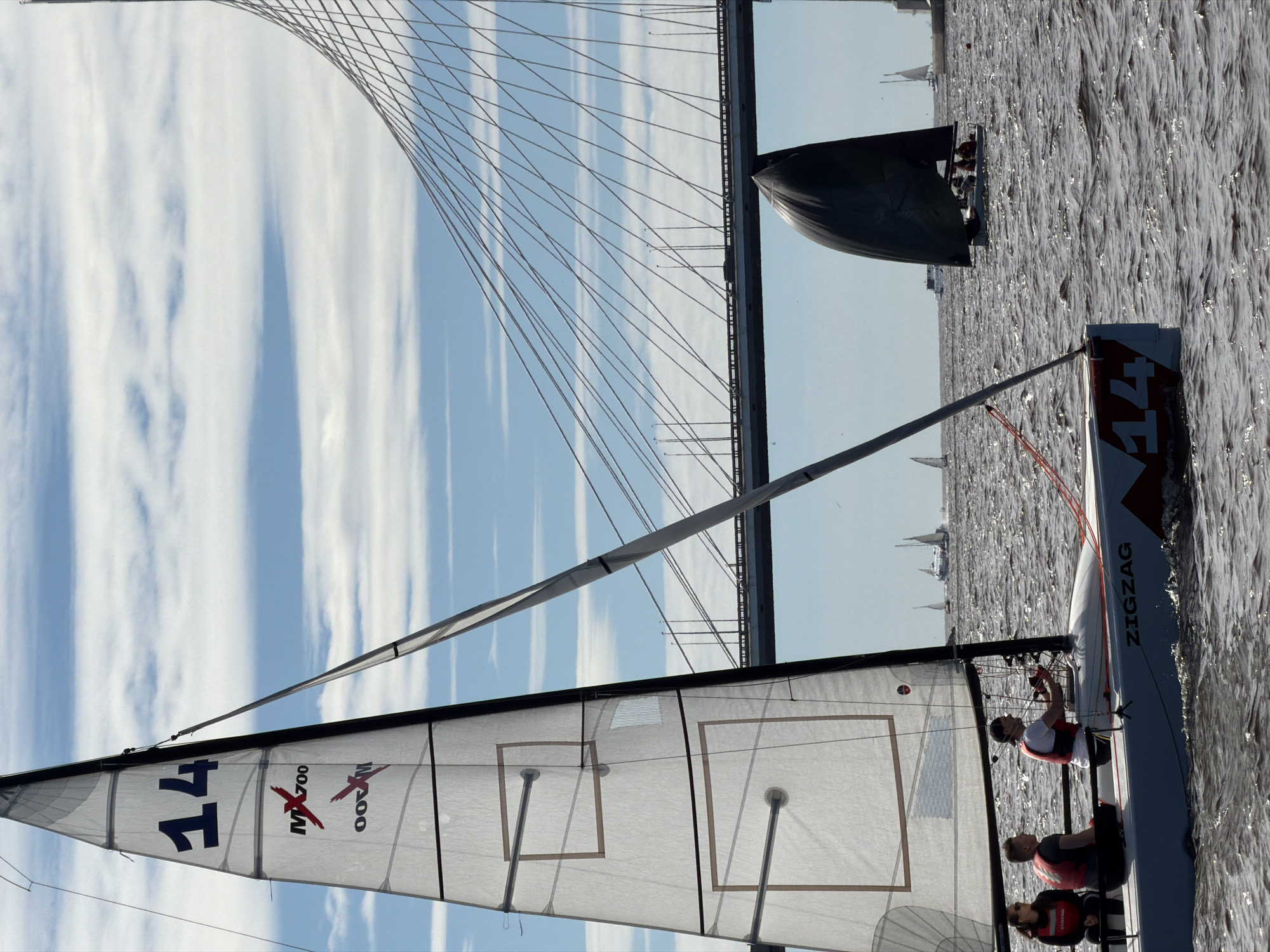 Sailing race on the Neva River, ZSD bridge backdrop, June afternoon