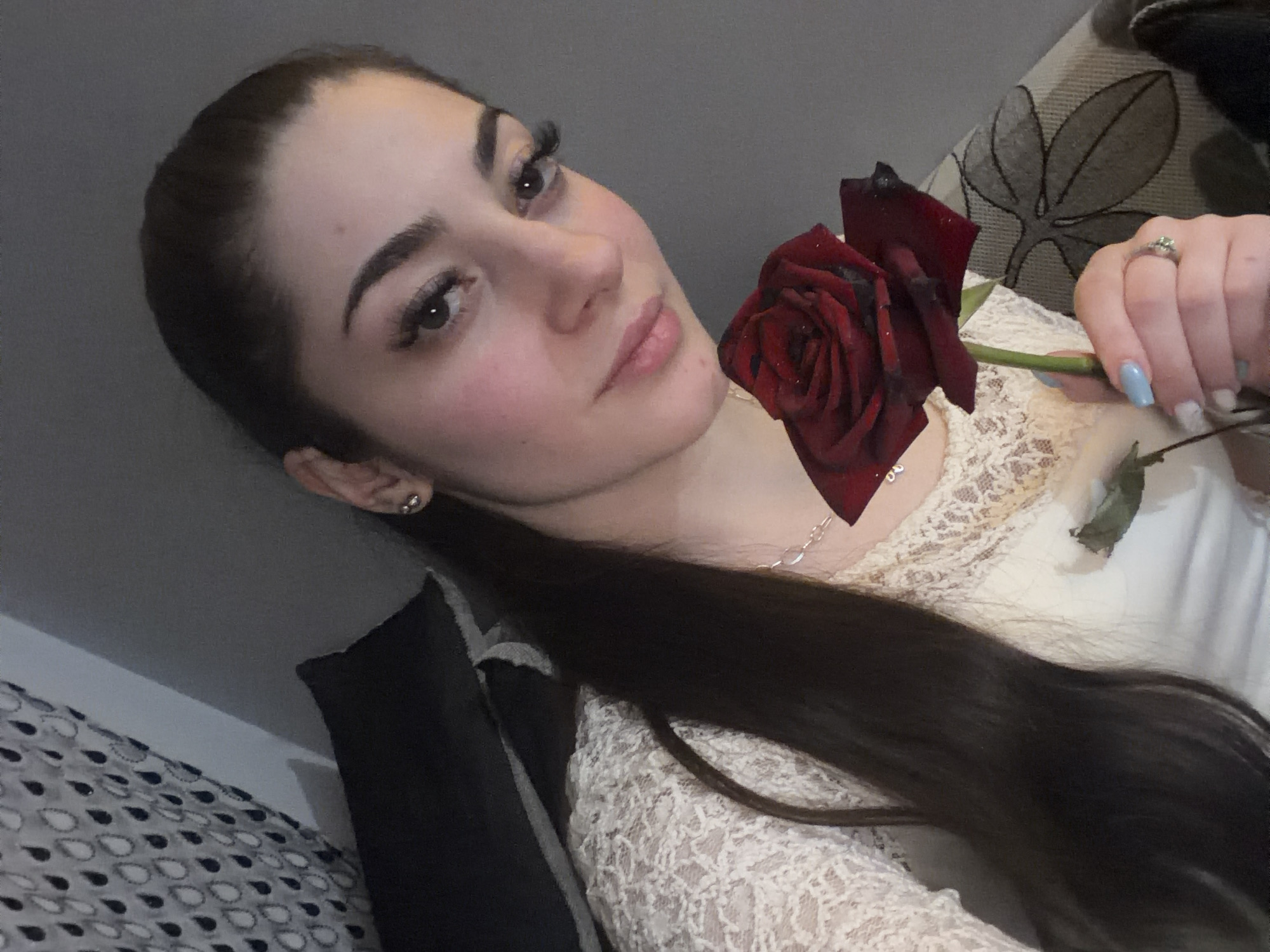Woman holds red rose in Sofia evening scene