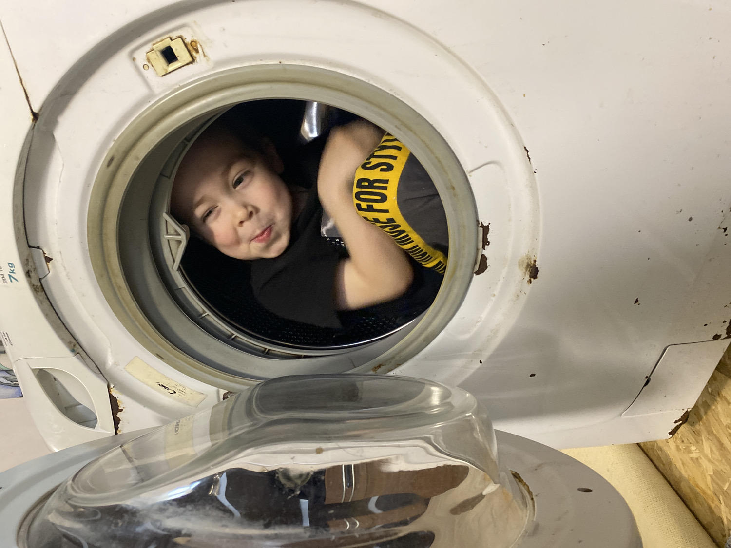 Child plays inside washing machine drum in Noviy, Russia