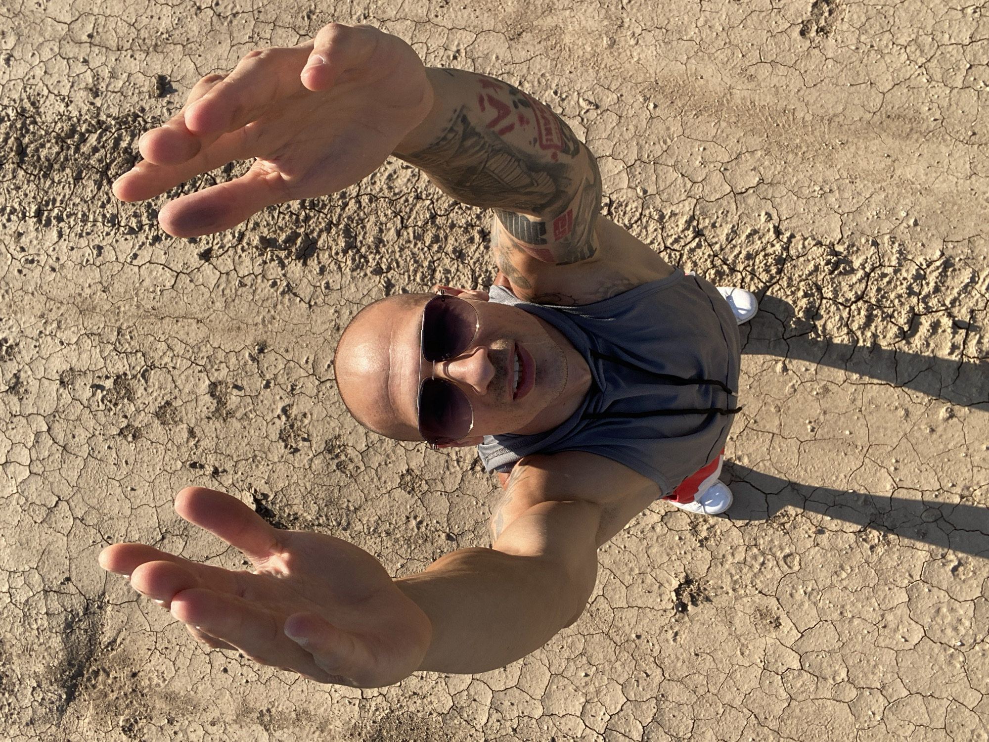 Hands up on cracked dry ground in Pleven, Bulgaria