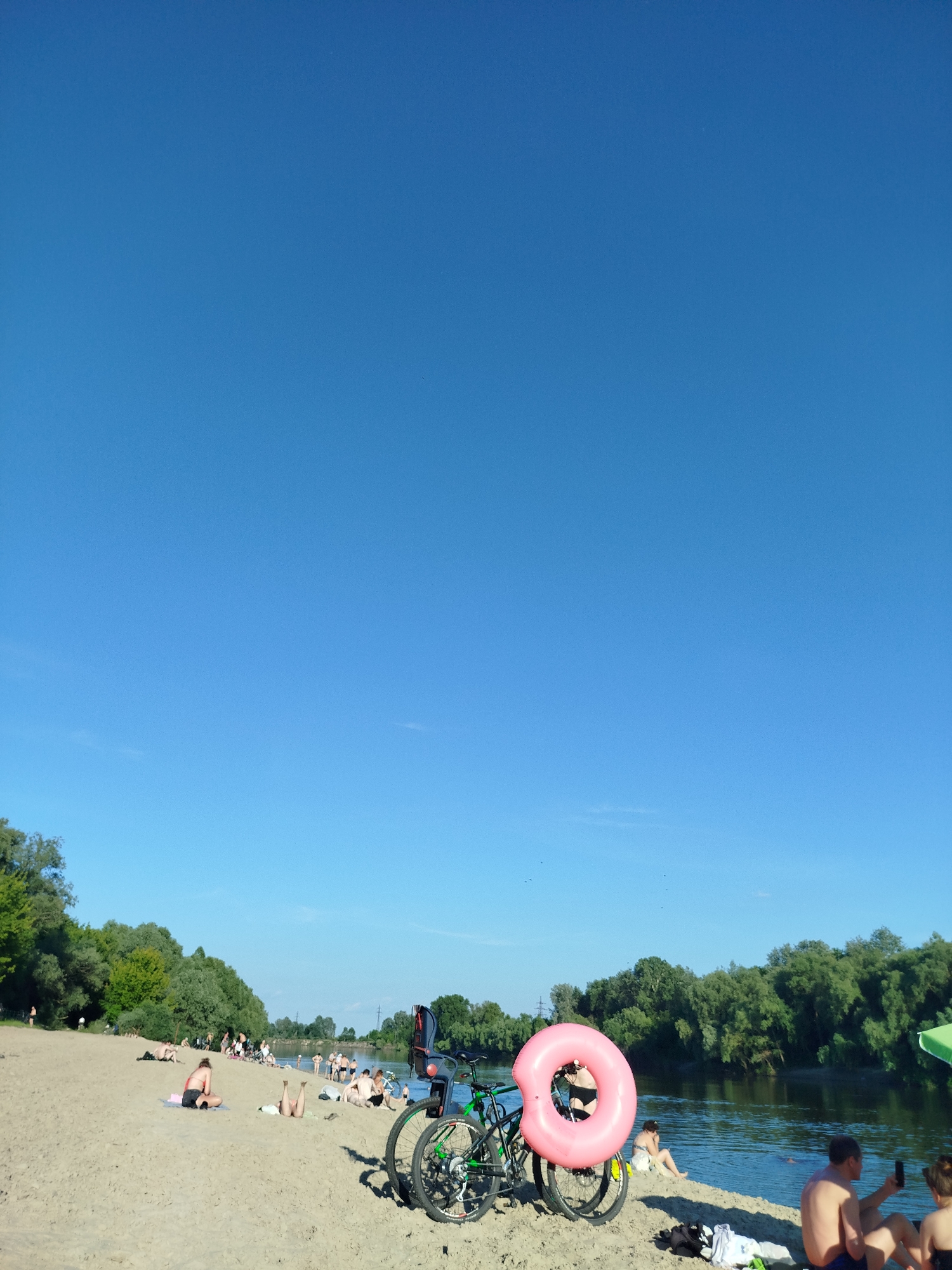 Sunny afternoon at Chernihiv's Desna River beach and park