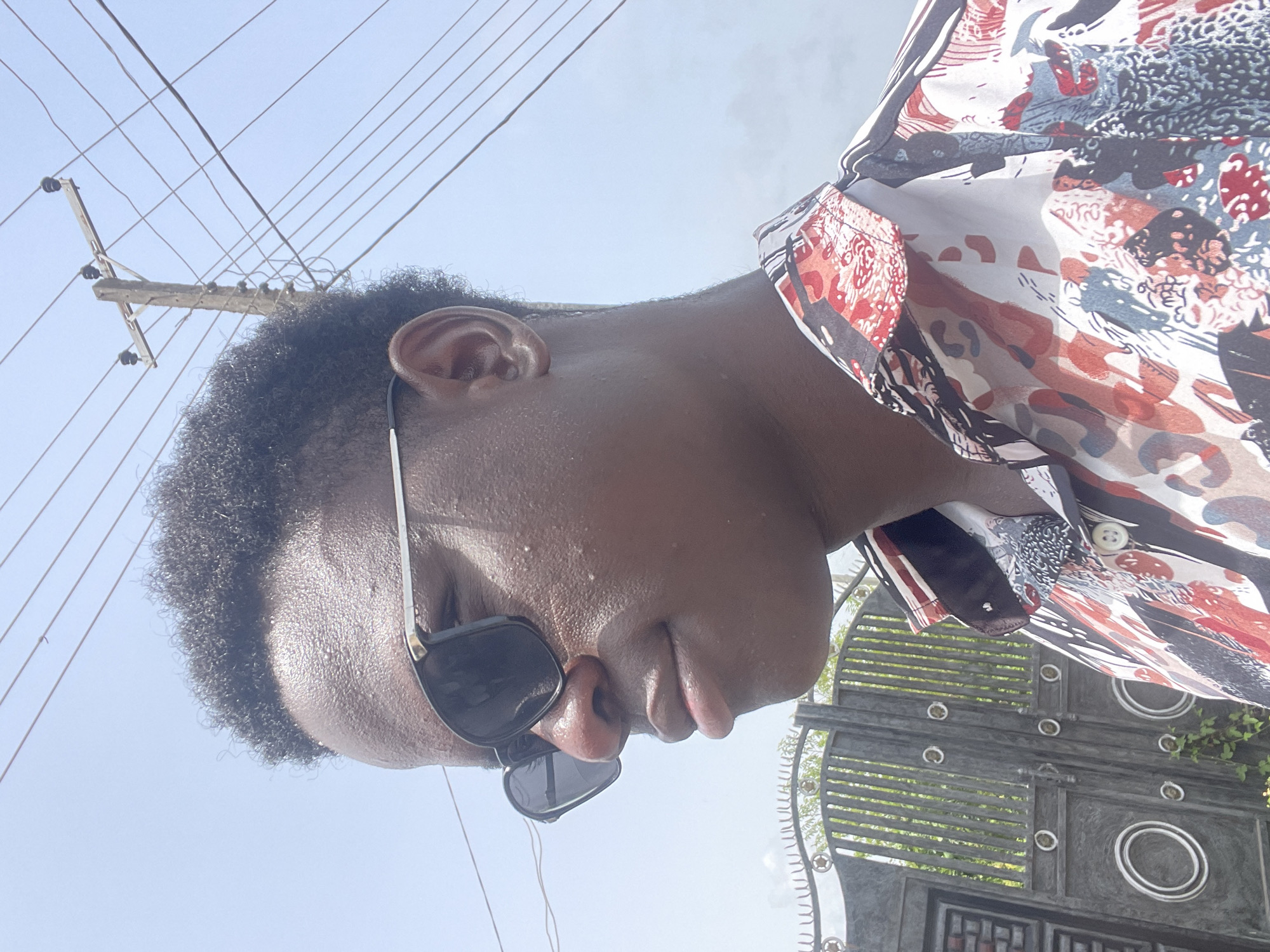 Person in sunglasses photographed multiple times in Badagry
