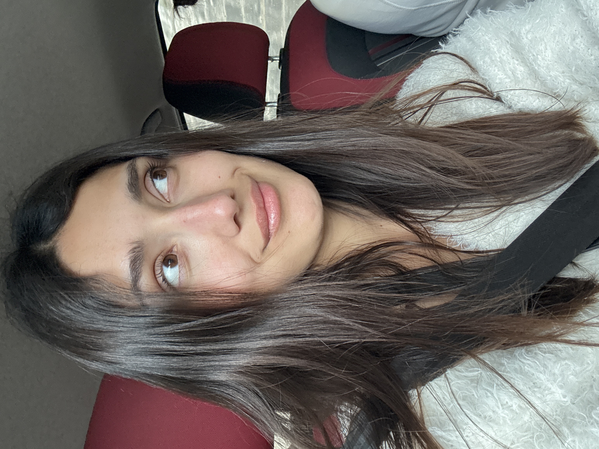 Woman takes selfie in car in Sutomore, Montenegro