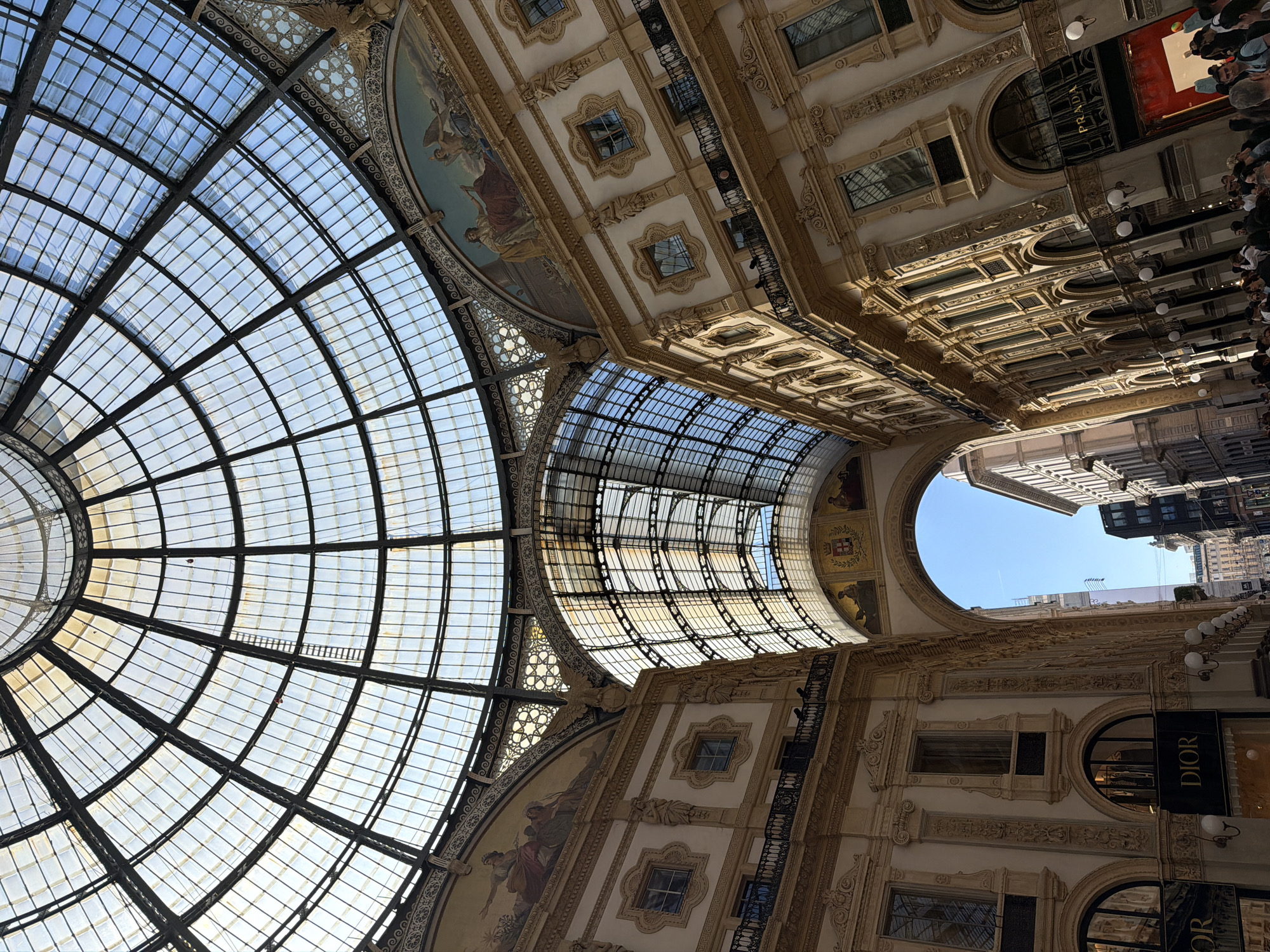 Tourist captures Milan's Duomo and historic streets in midday photos