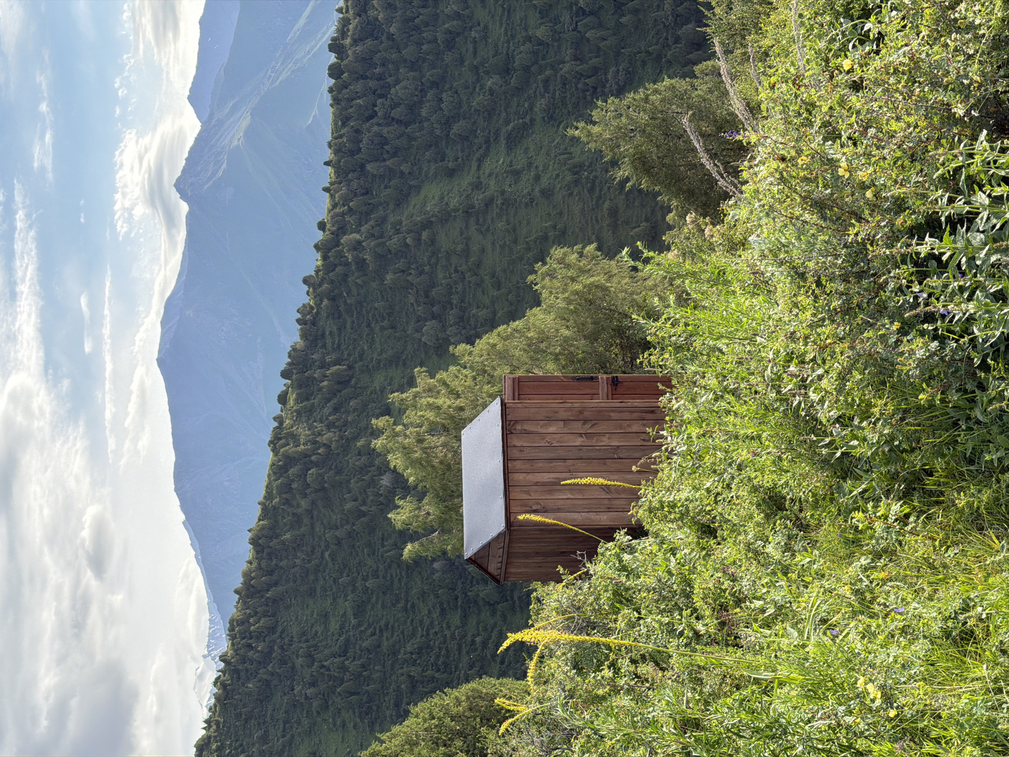 Mountain views and a ski lift station above Kashka Suu