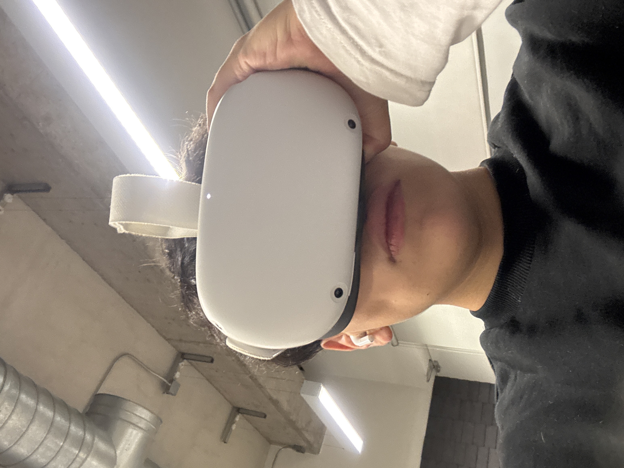 Person uses VR headset in industrial space, Mexico City