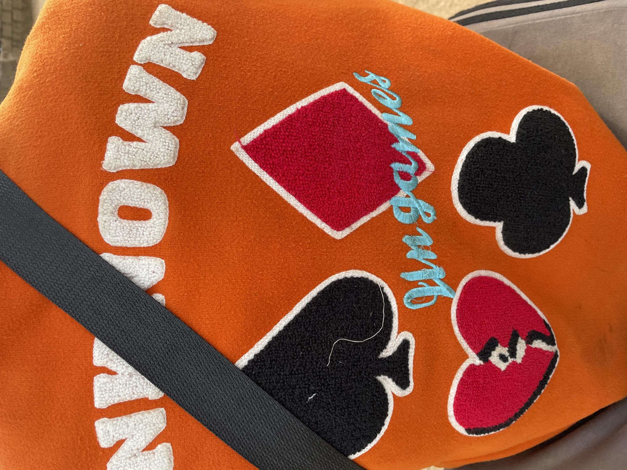 Orange playing card-themed bag spotted in Gura Top, Nigeria