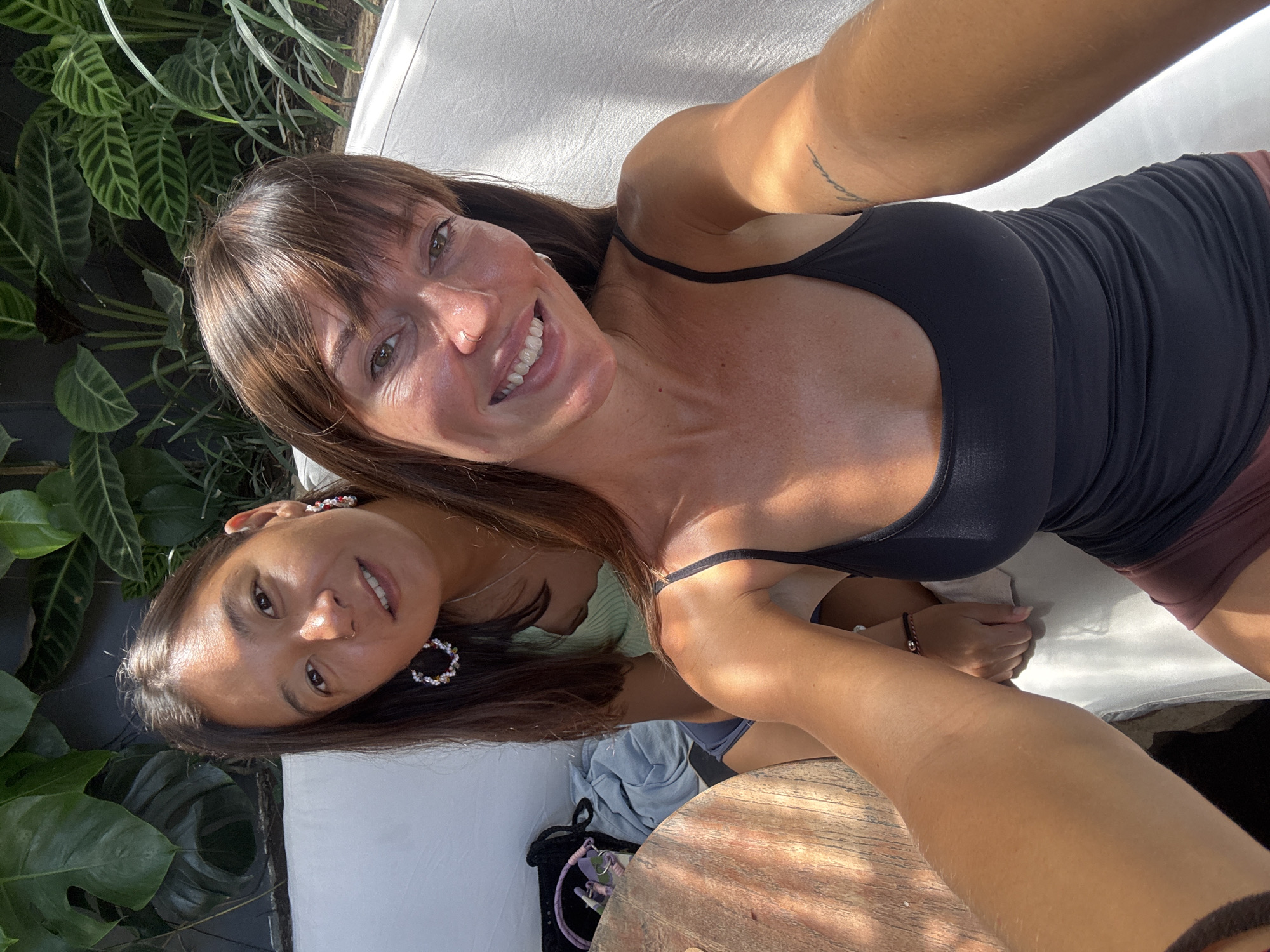 Two women take selfie outdoors in Kuta Selatan