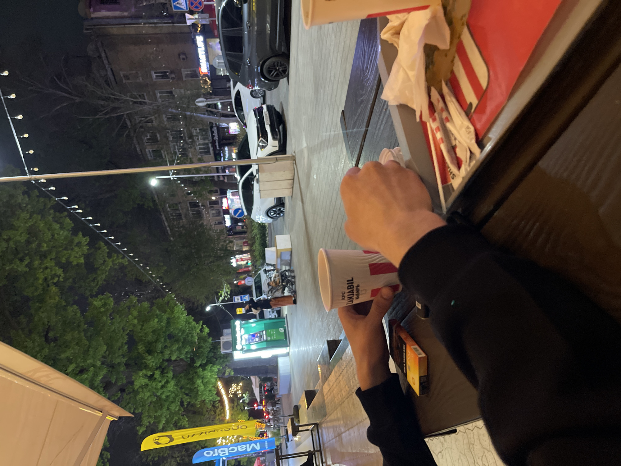 Customer enjoys KFC meal outdoors in Tashkent