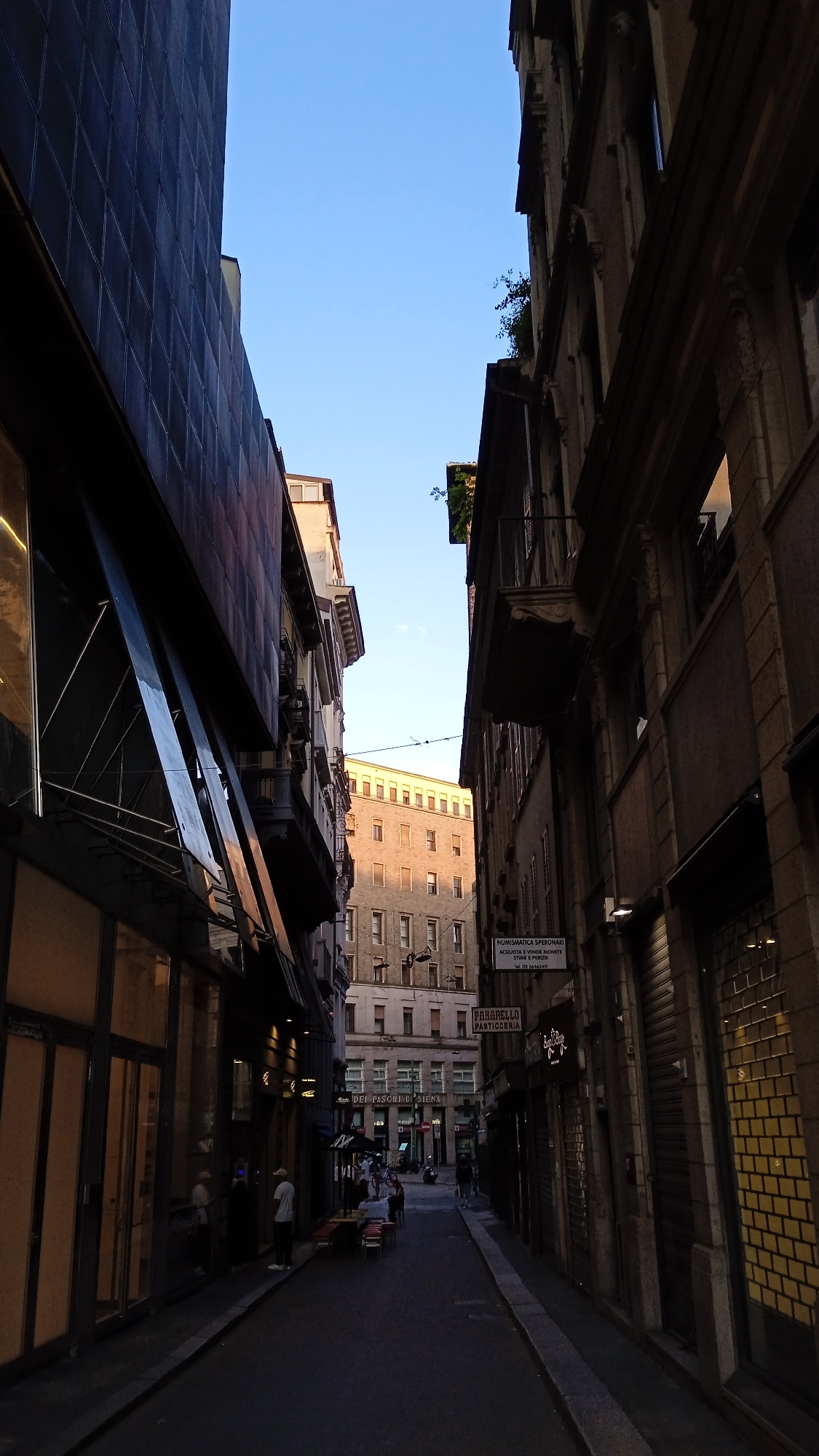 Milan streets, San Sebastiano church, and a shoe shop window