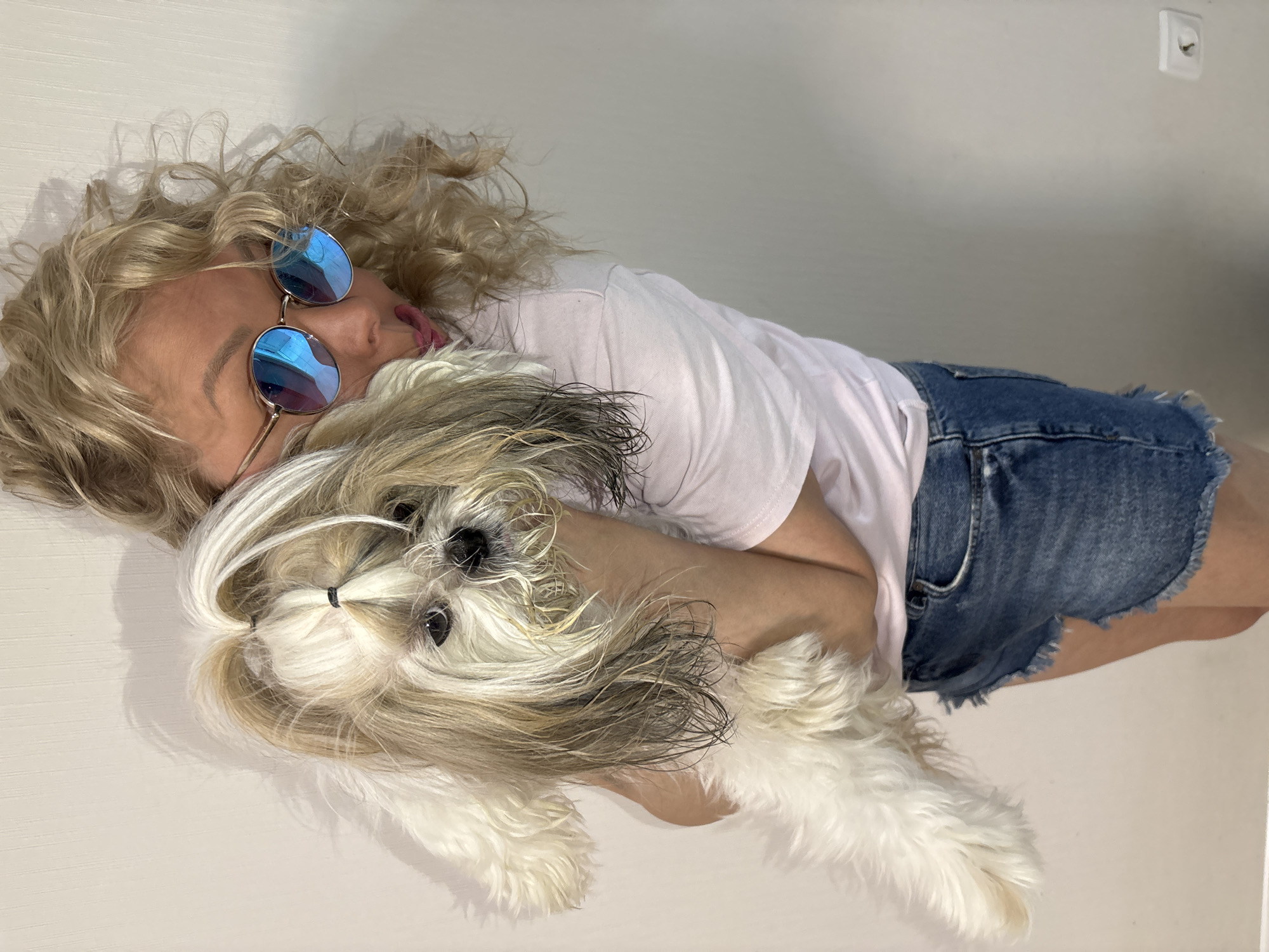 Blonde woman in cracked sunglasses spotted in Izhevsk with dog