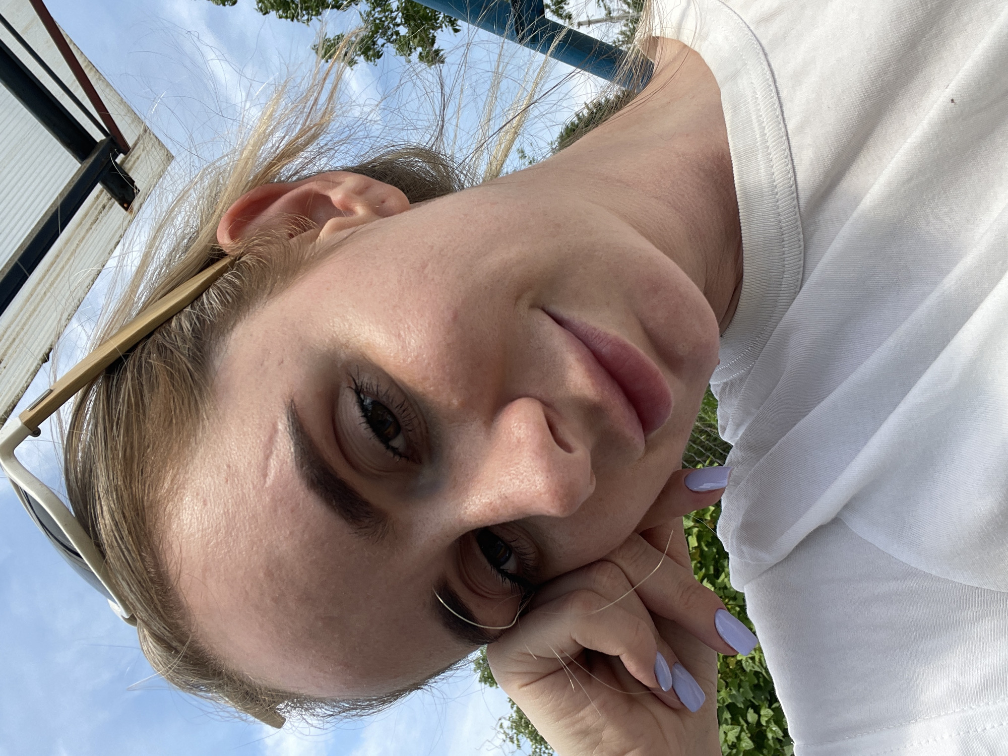 Woman takes outdoor selfies in Yasnoe, Russia