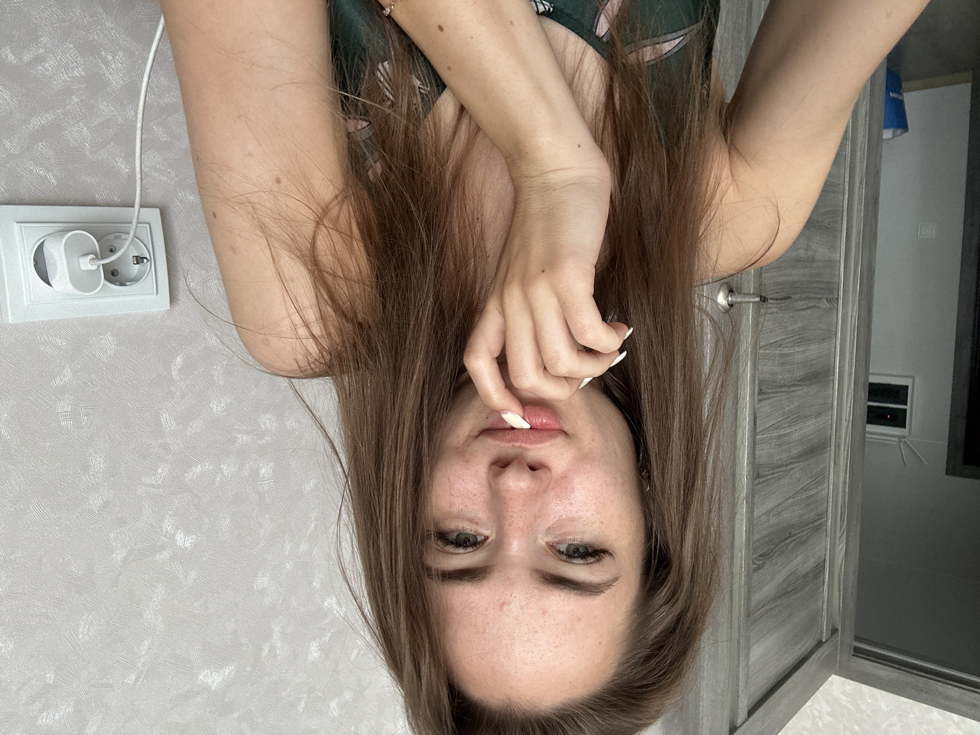 Indoor selfie session with various poses and outfit changes