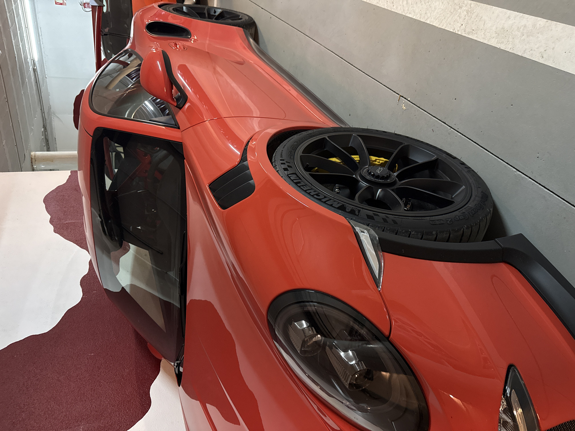 Luxury sports cars photographed in Benasque garage showroom