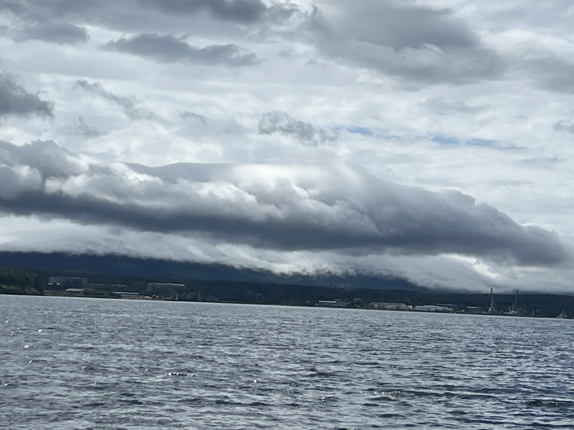Inflatable boat on choppy water near Zavety Il'icha, Russia