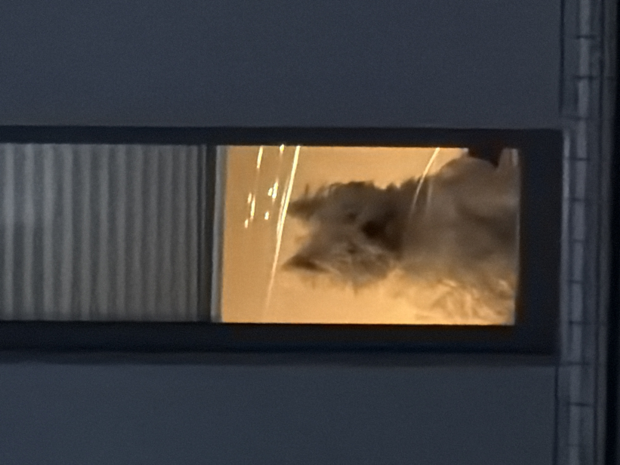 Orange light illuminates window object in Luxembourg building