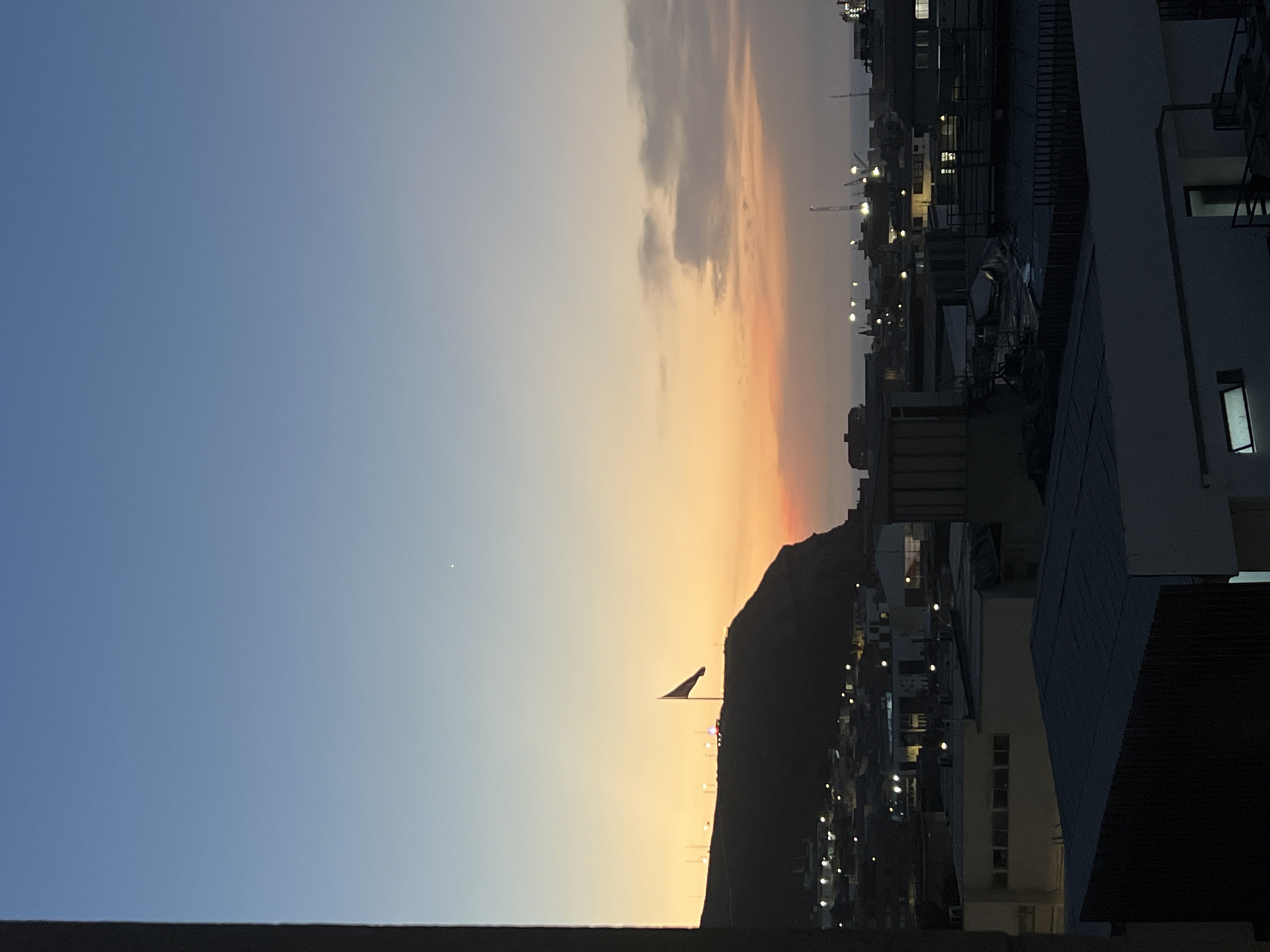 Chilean flag captured waving at twilight in Arica