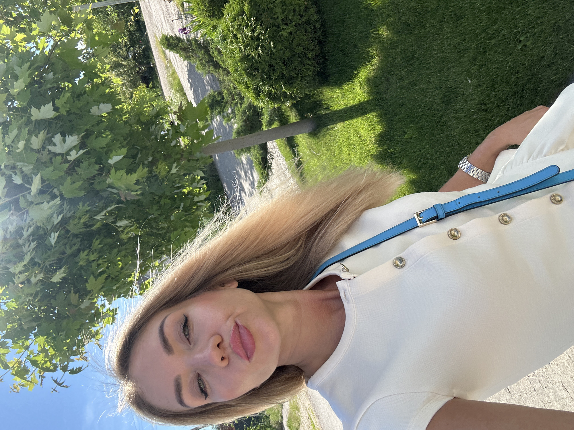 Woman takes selfies among blooming roses in Armavir garden