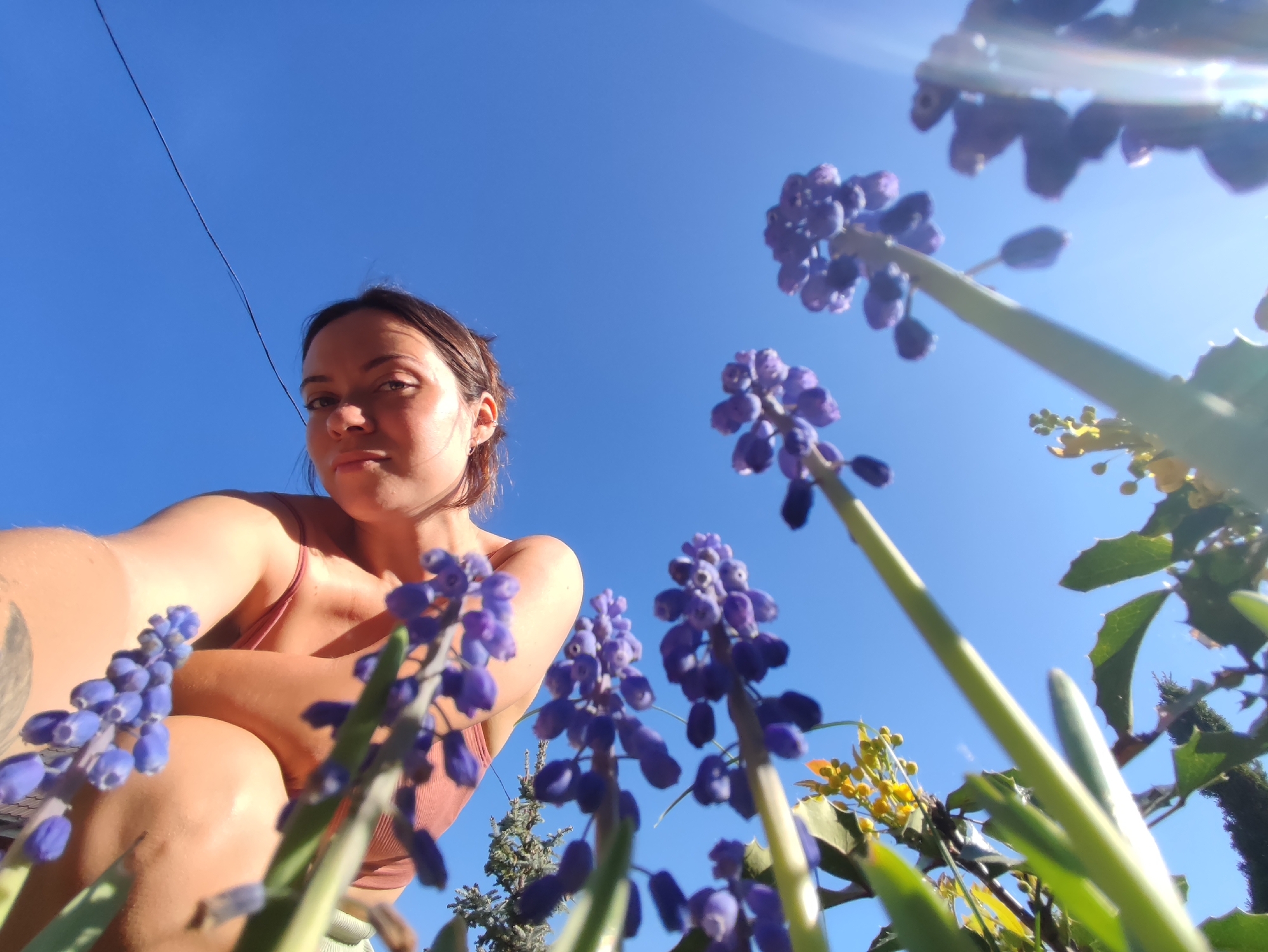 Mother and toddler enjoy spring morning garden play in Russia
