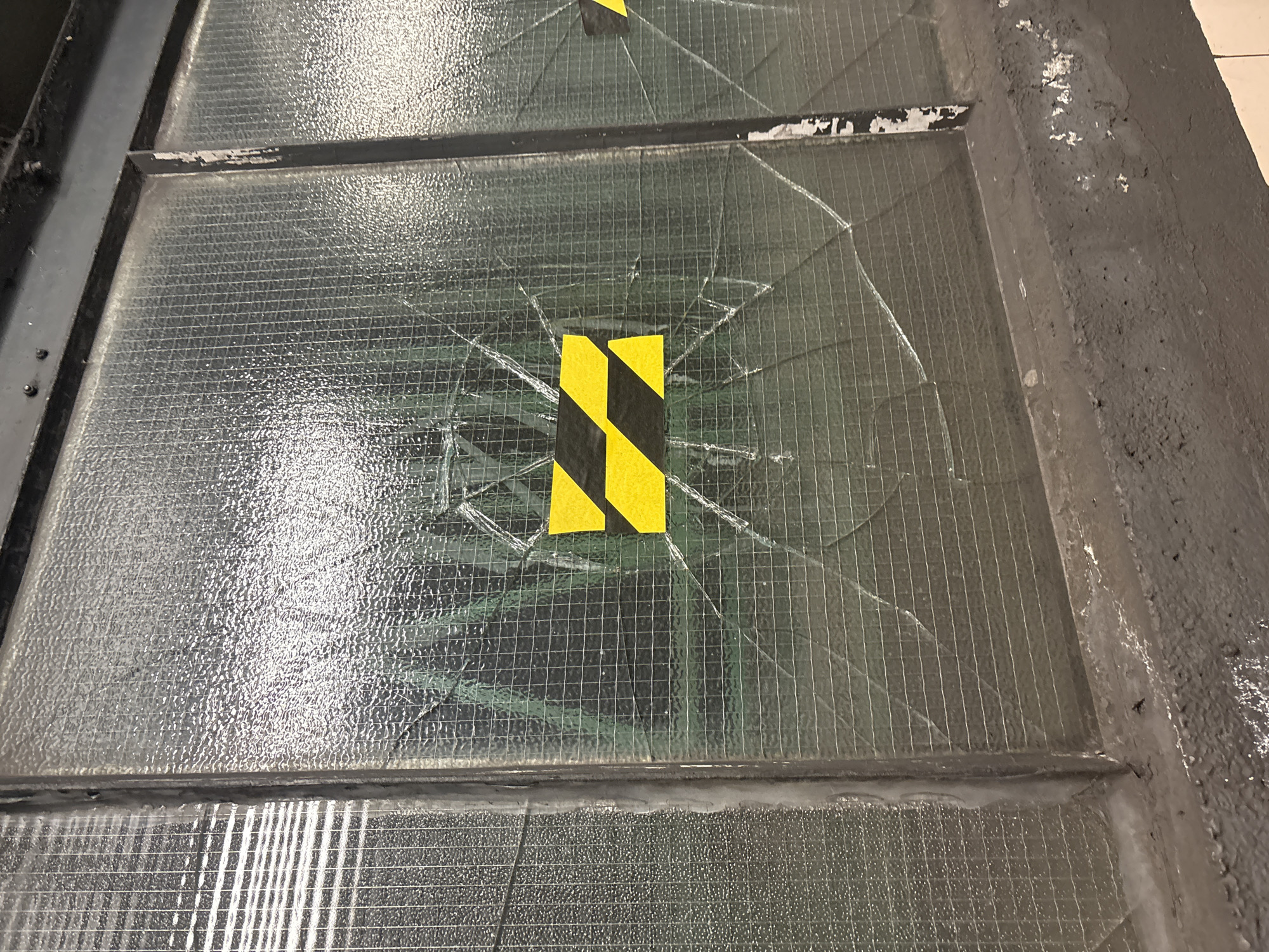 Damaged reinforced glass panel observed in London