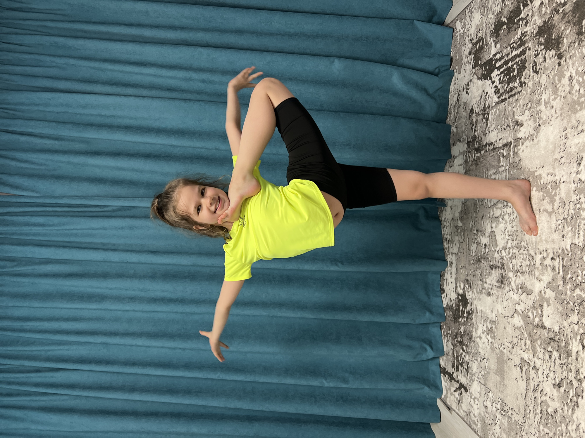 Girl practices gymnastics at home in Chaikovsky, Russia
