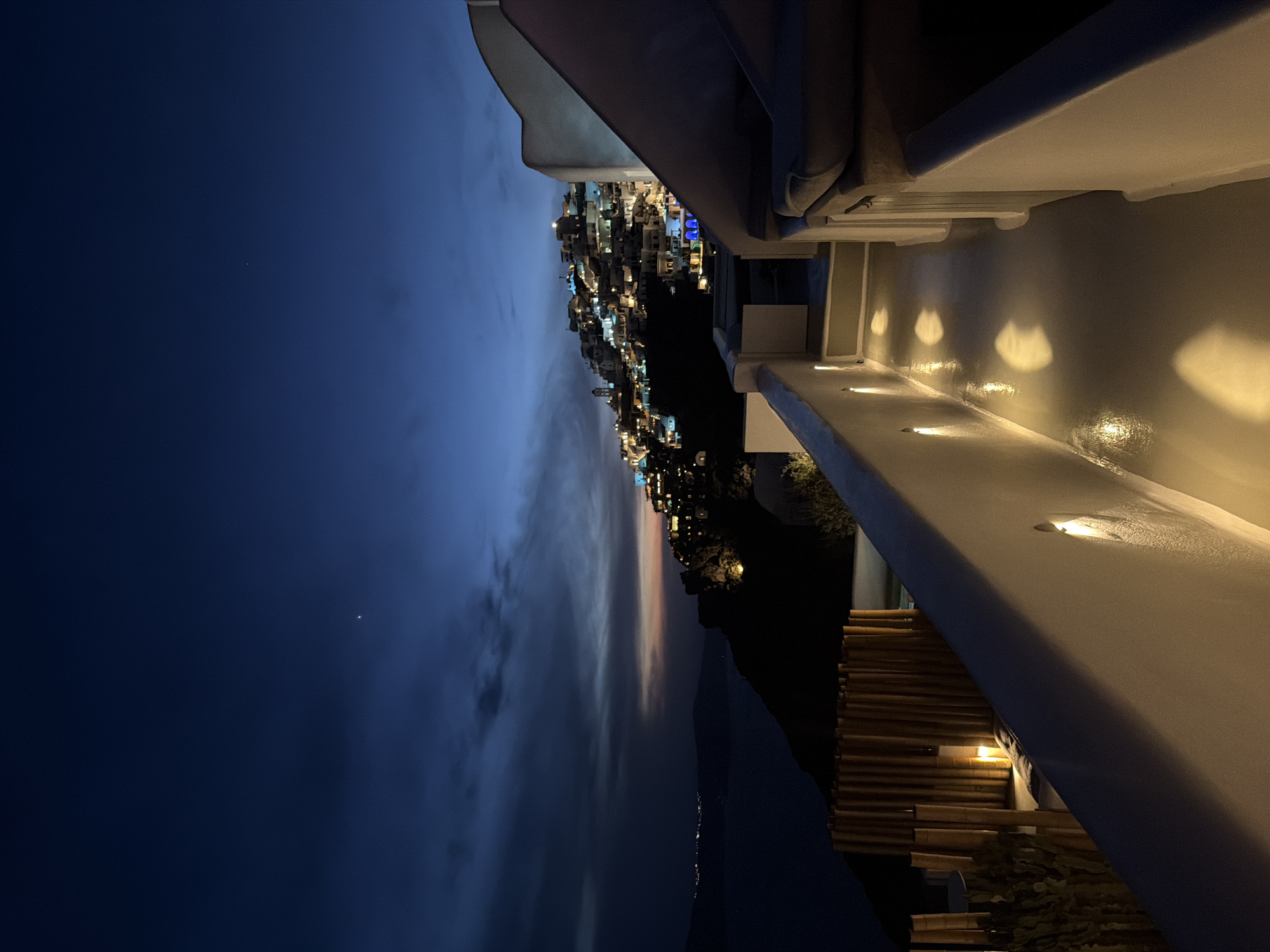 Nighttime view captured from lit structure in Thira, Greece