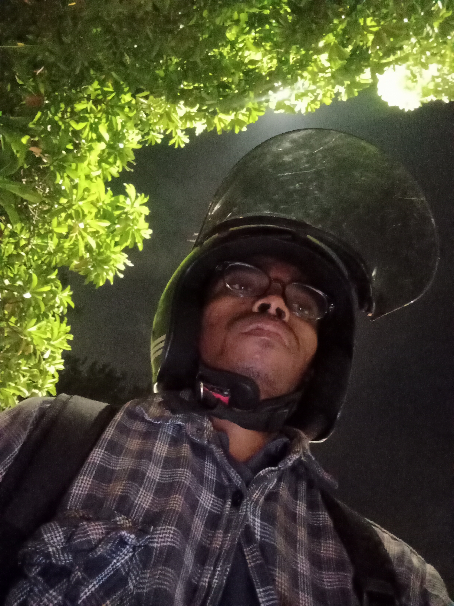 Night ride selfie in Surabaya, helmeted and ready to go