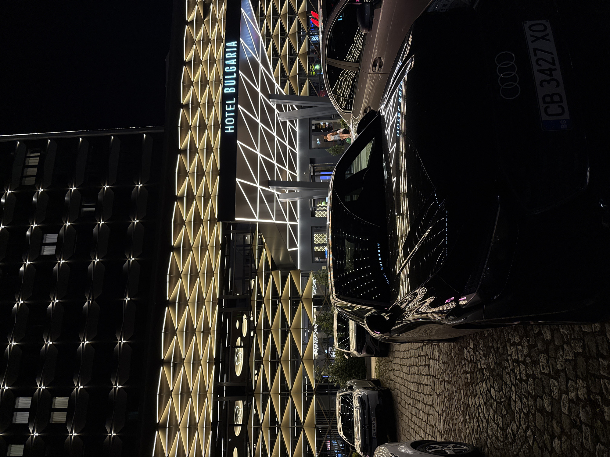 Evening at Hotel Bulgaria: lit facade, cozy lounge, statement jewelry