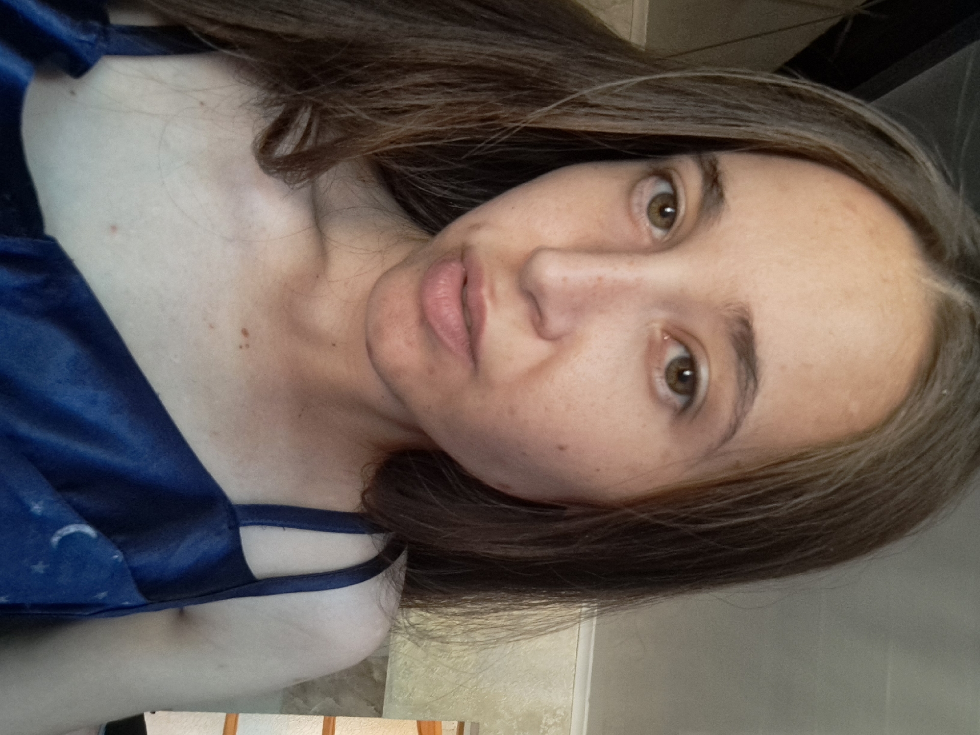 Selfie series in a Ukrainian home, celestial camisole and red bracelet