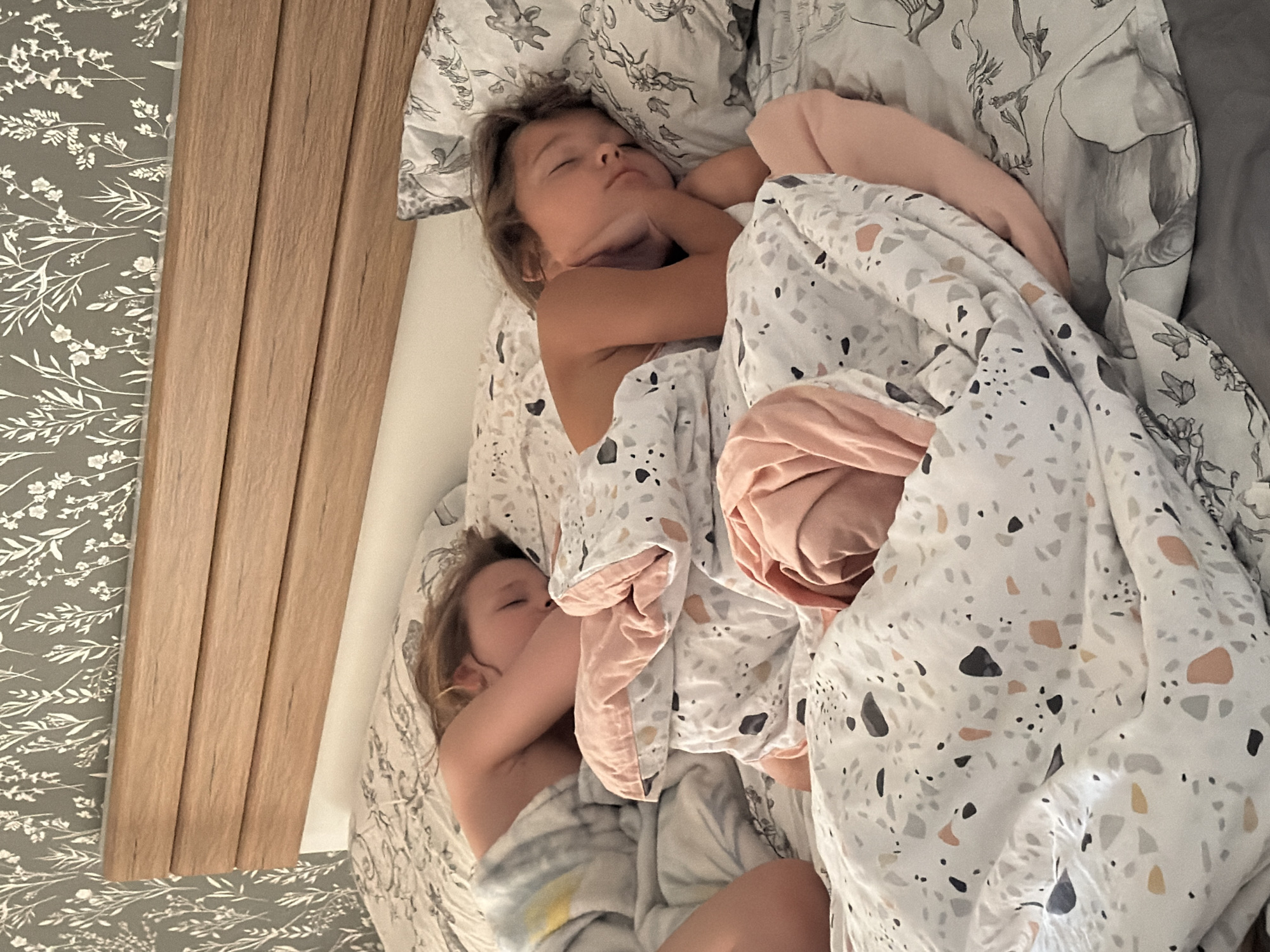 Two children sleep peacefully in Krasnoyarsk bedroom