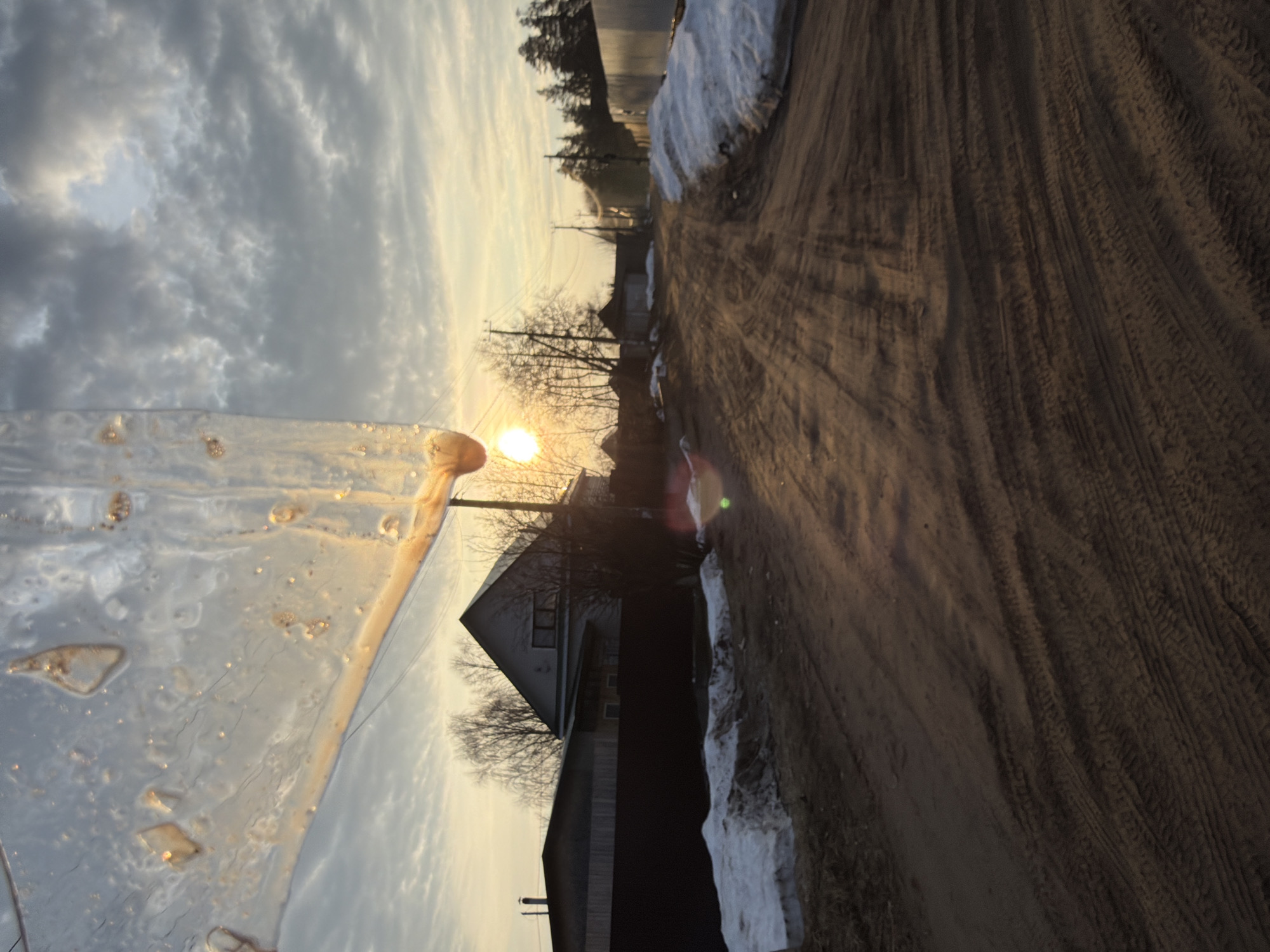 Spring ice formations documented in Chaikovsky, Russia during sunrise