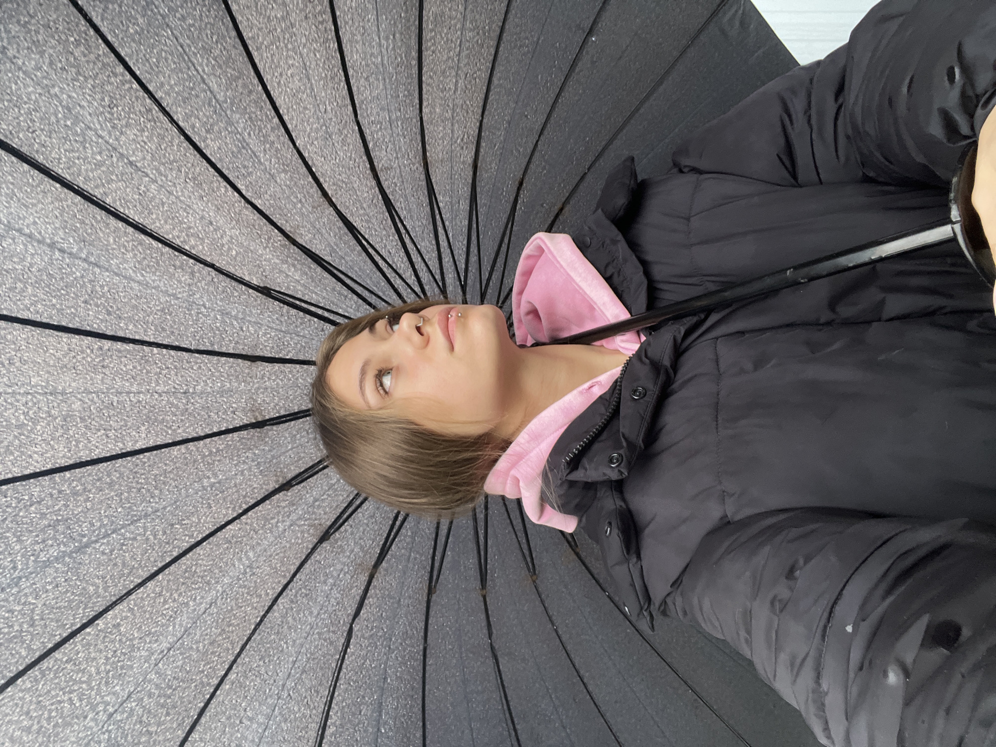 Woman with umbrella spotted in Russian town during early morning