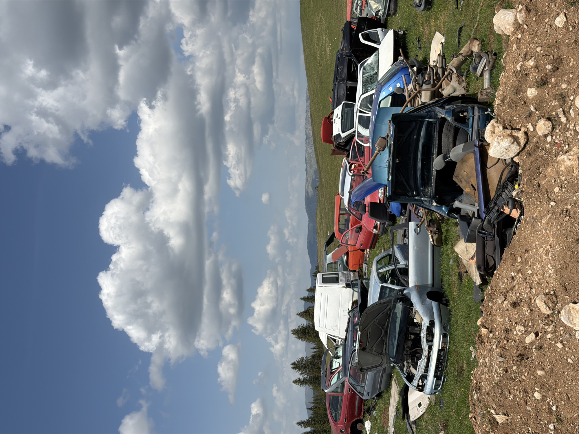 Tourist documents vehicle junkyard in rural Montenegro mountains