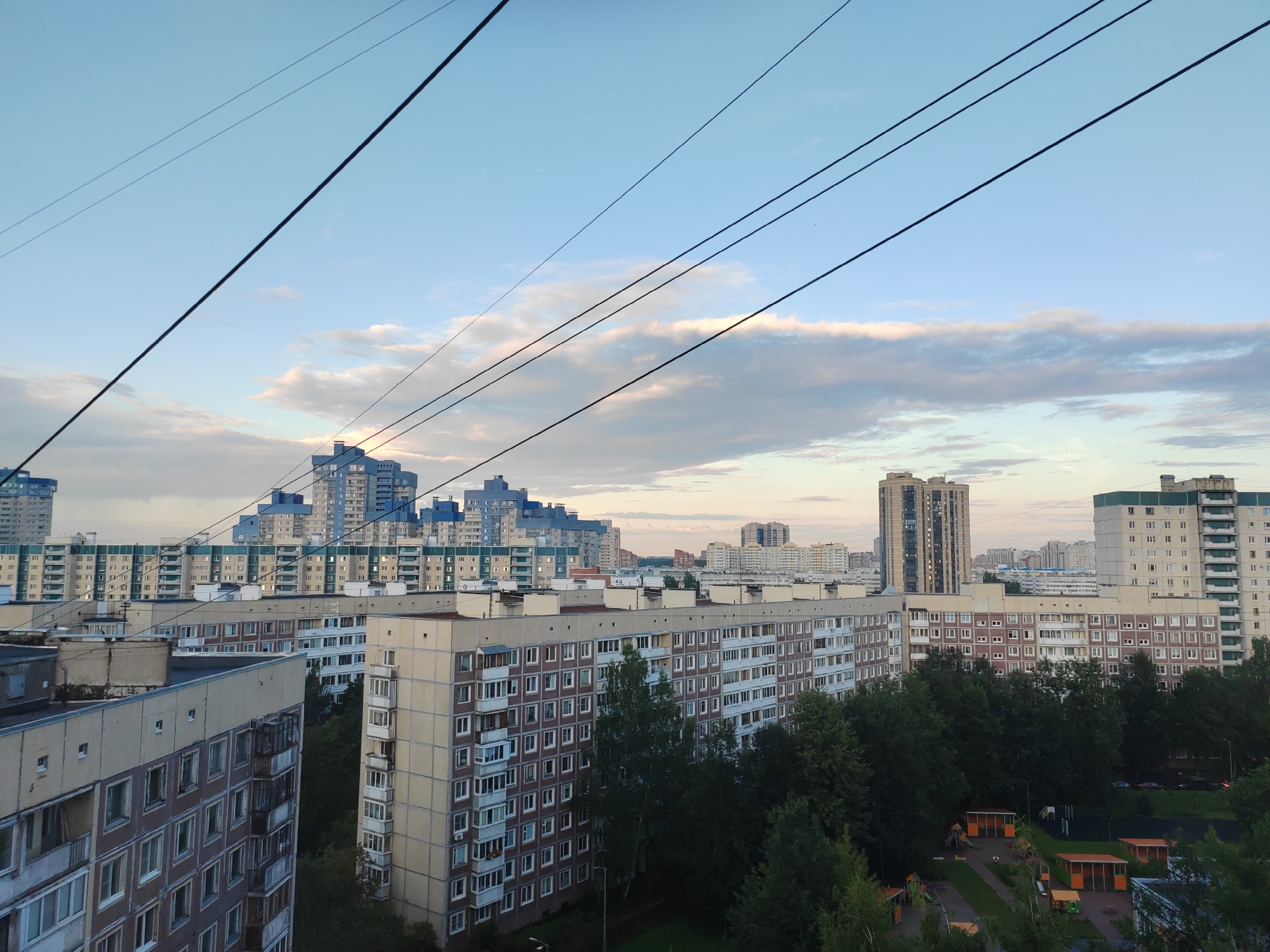 Dusk over a Saint Petersburg residential district, husky resting inside