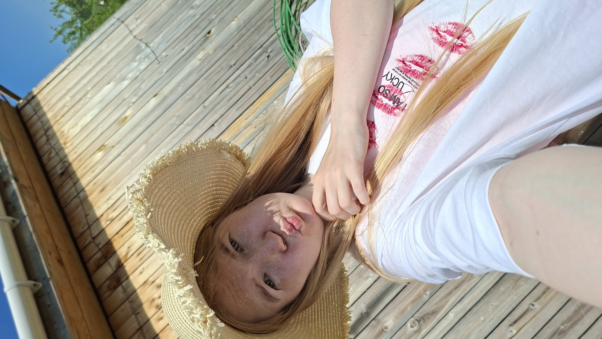 Woman in lucky shirt photographed on deck in Russia