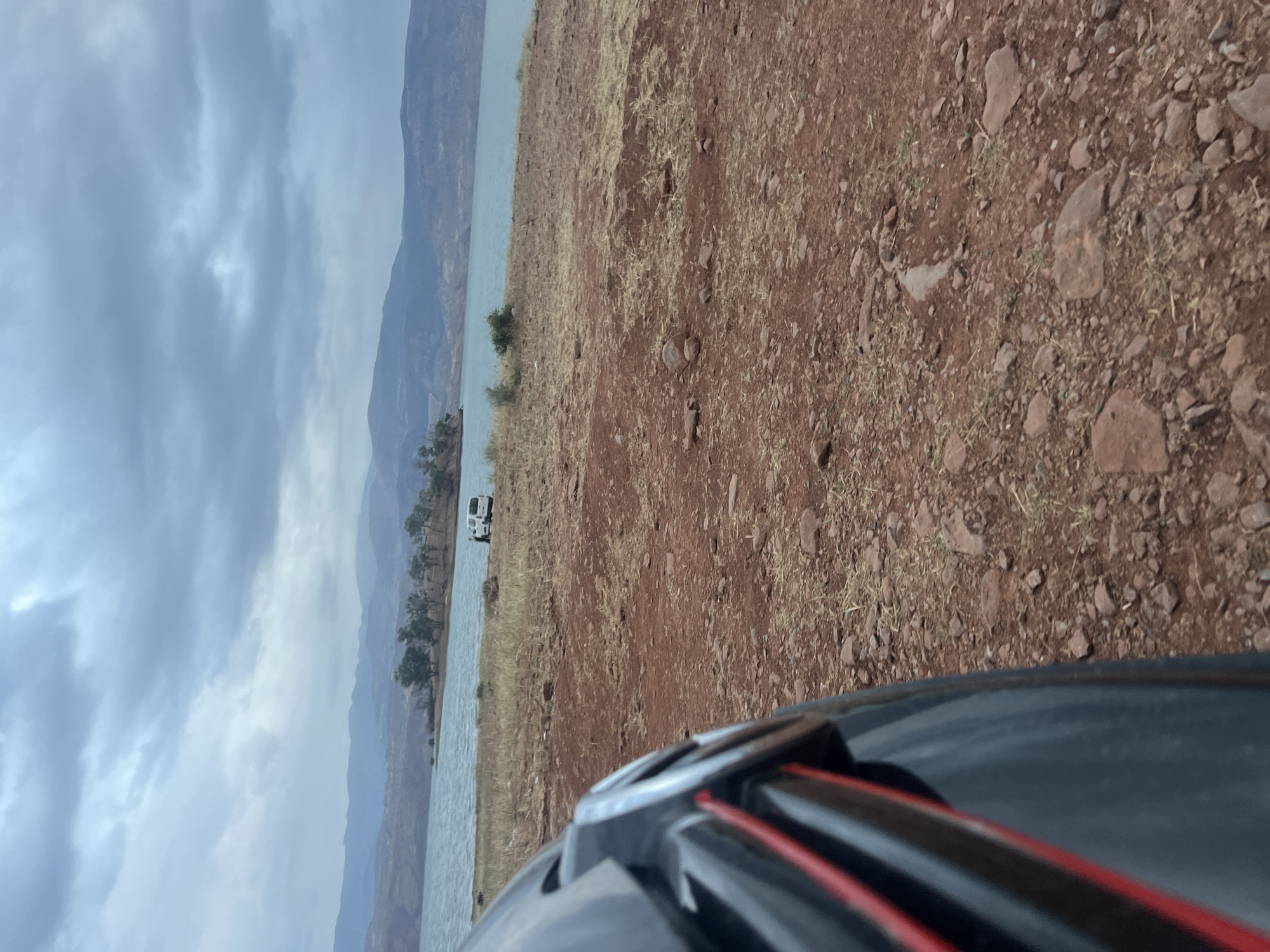 Traveler documents lakeside stop at Bin El Ouidane reservoir Morocco