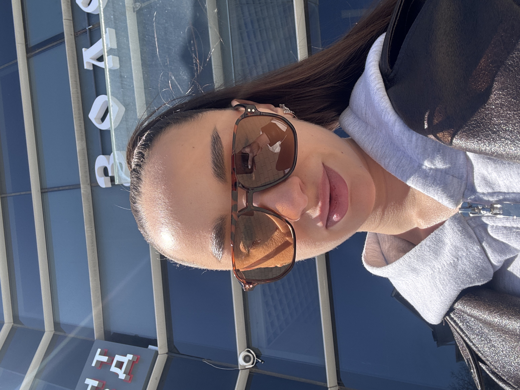 Woman takes sunny selfie in Belorechensk, Russia