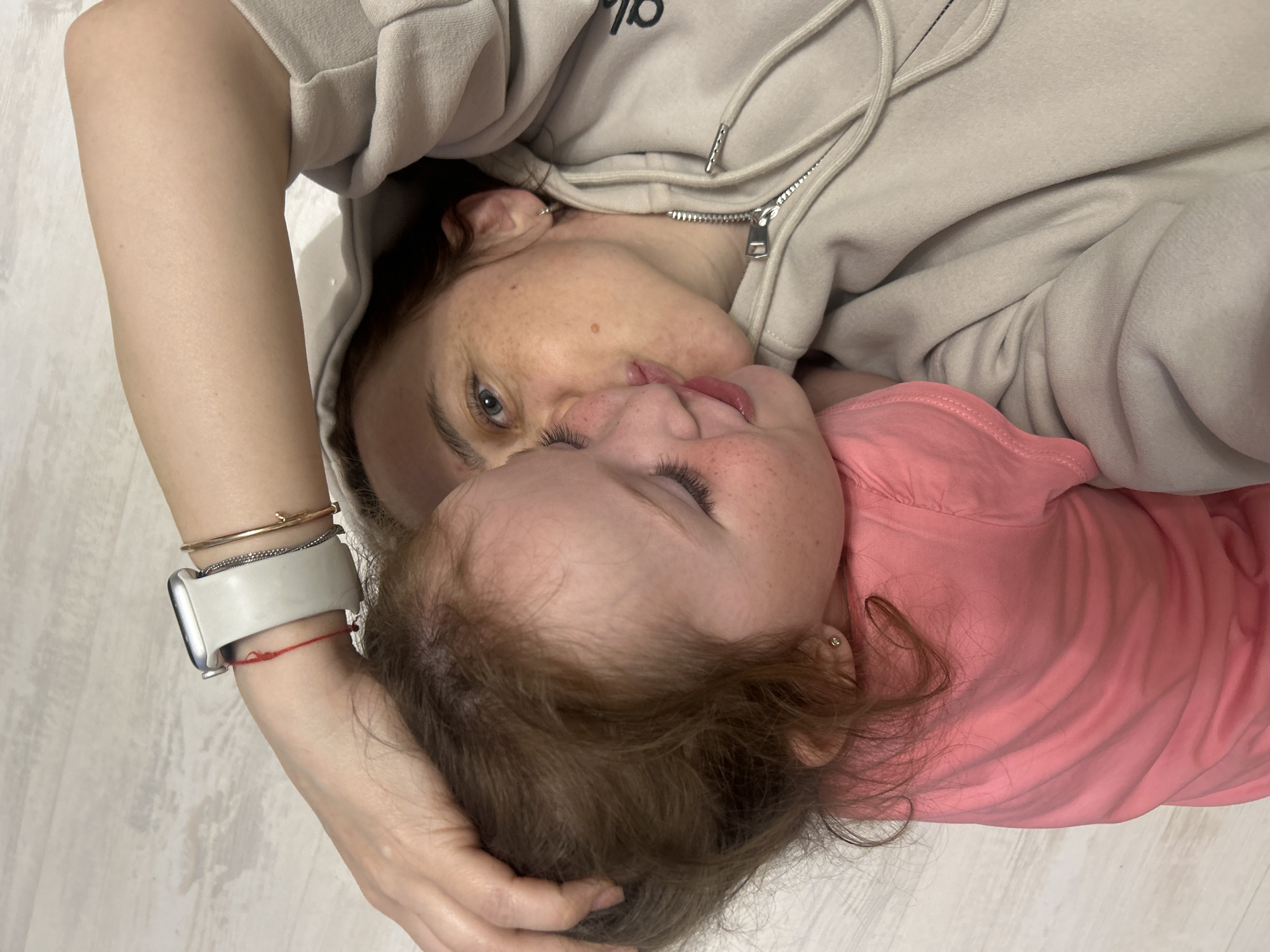 Adult and child share close moment in Chaikovsky