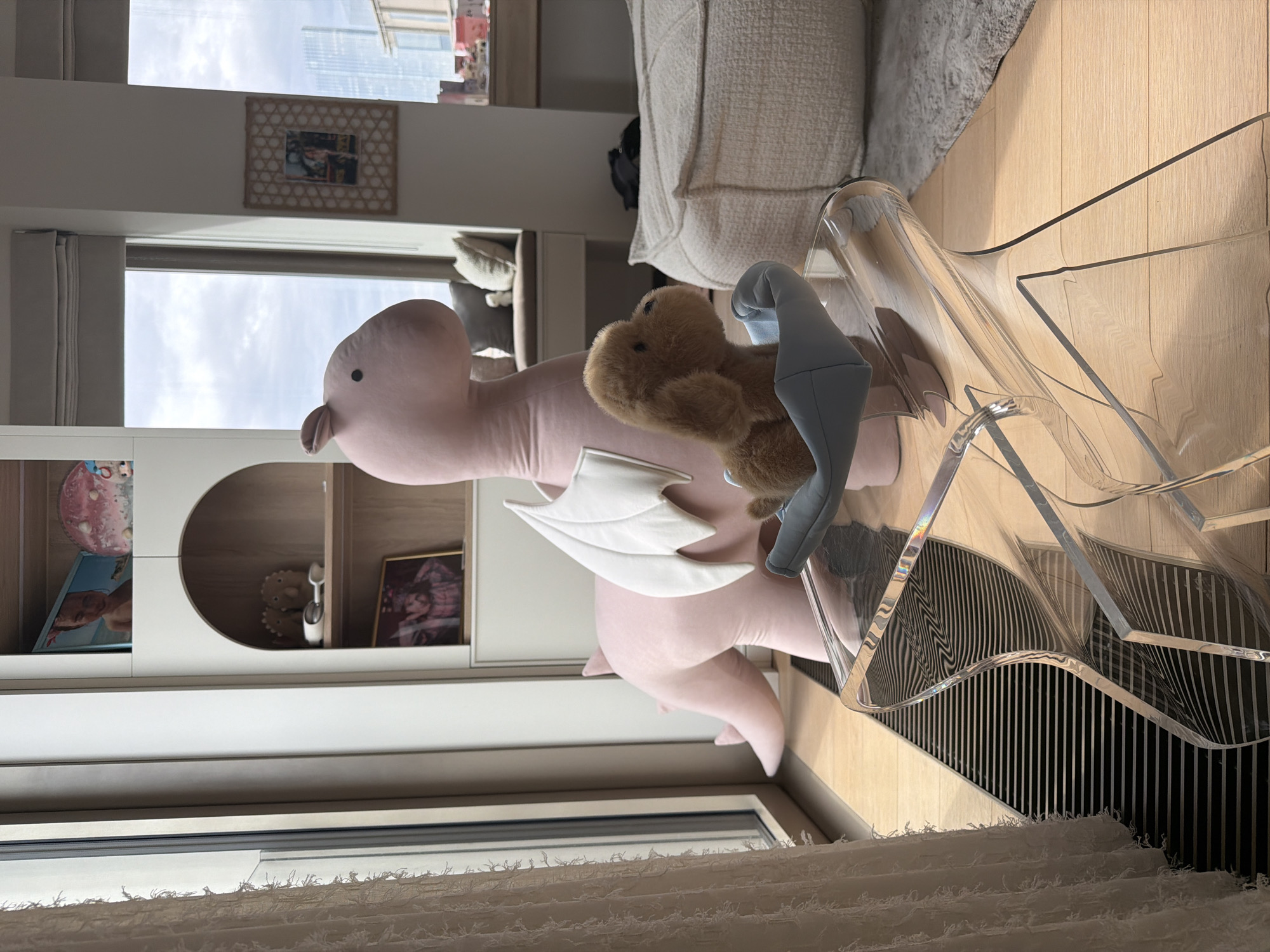 Stuffed dragon and bear spotted on chair in Moscow room