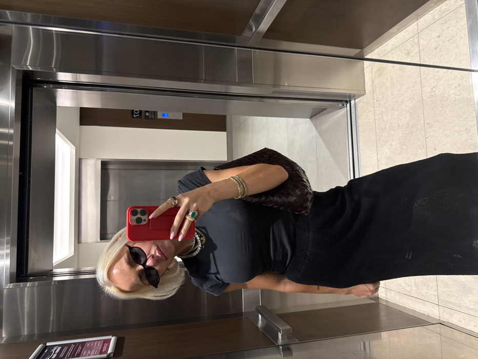 Blonde woman photographed twice in Dubai elevator, street scenes