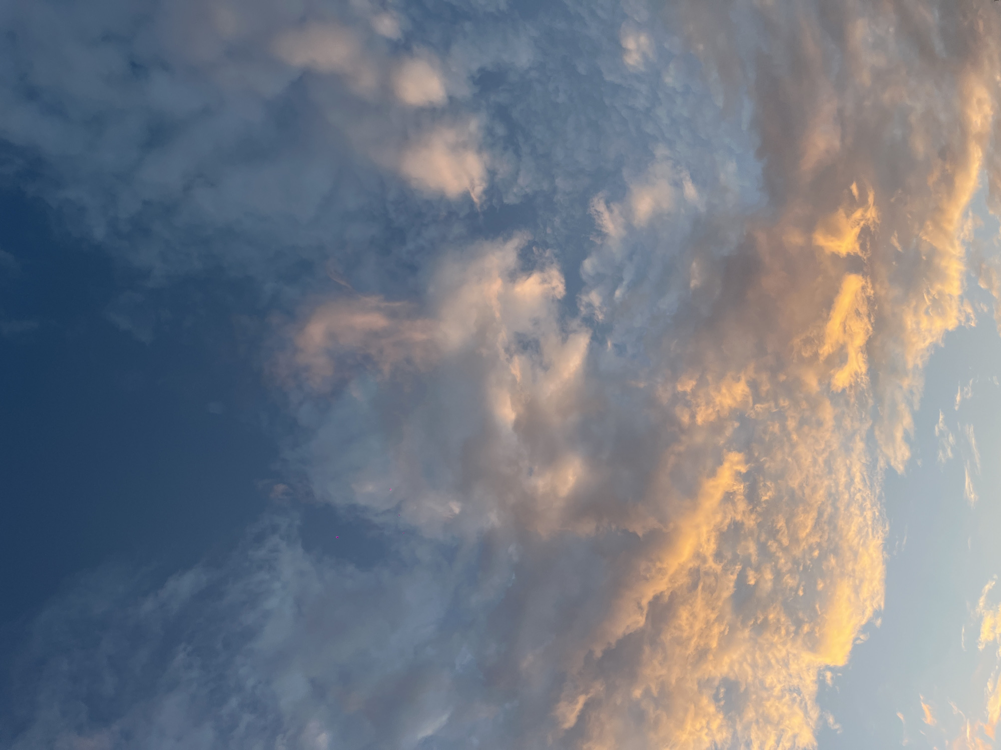 Golden-lit clouds photographed over Mérida, Mexico