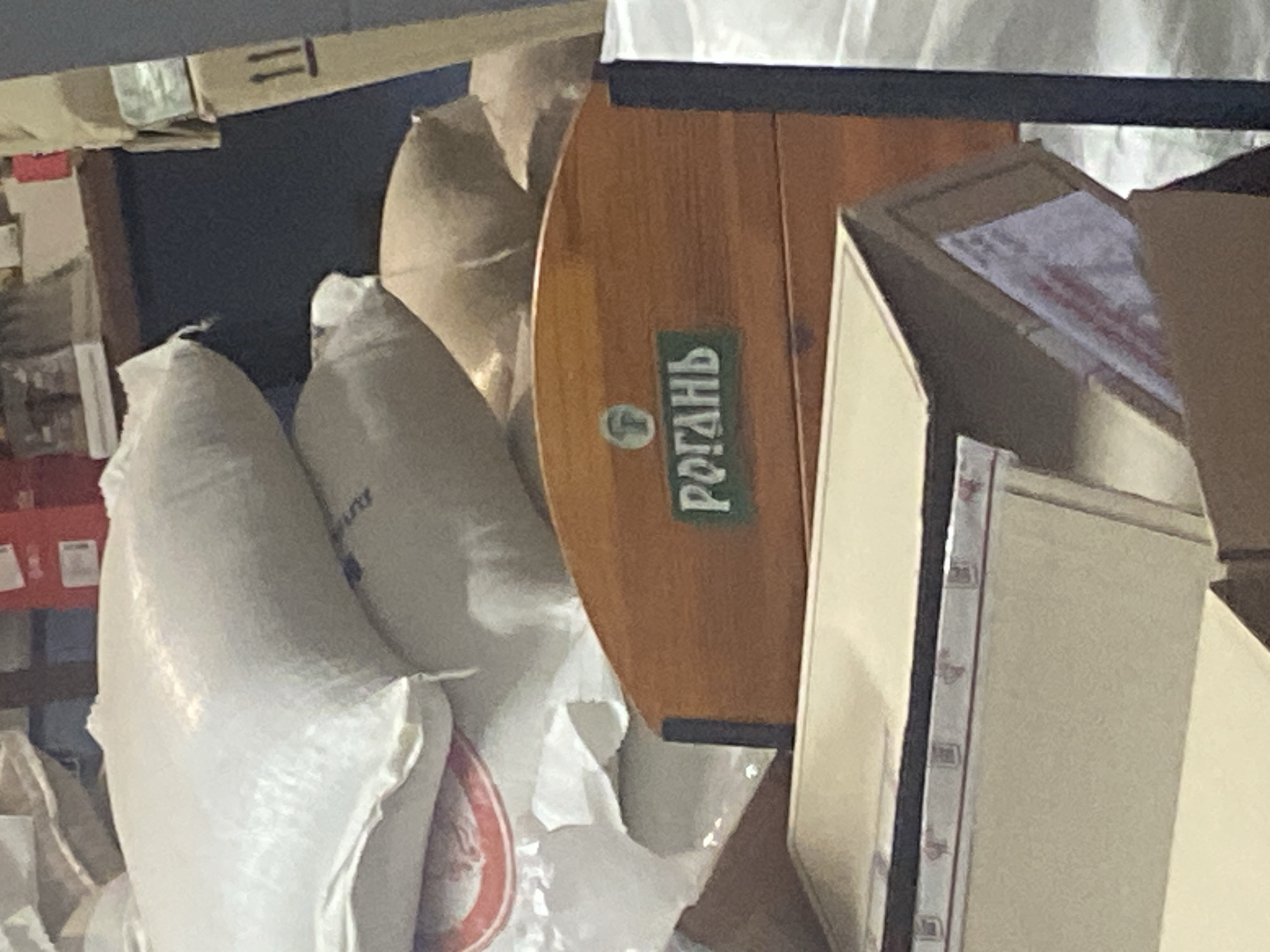 Inside a warehouse space marked with Cyrillic signage