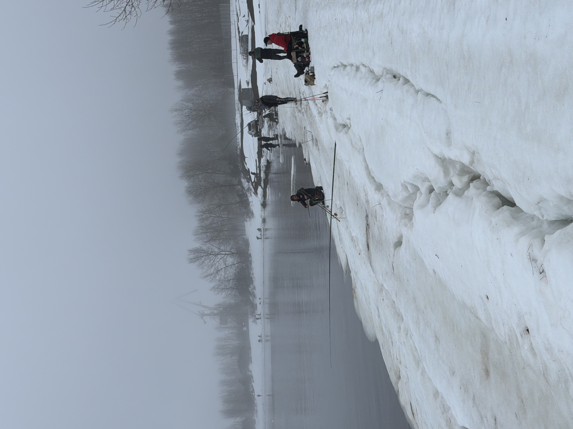Ice fishing group braves foggy morning in Chaikovsky, Russia