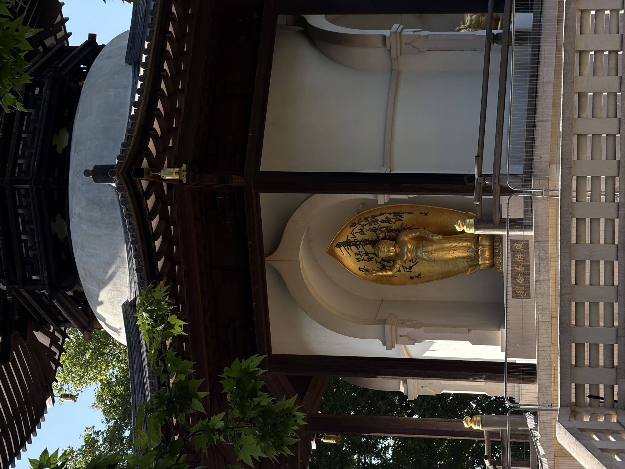 Golden reclining Buddha statue observed in London building