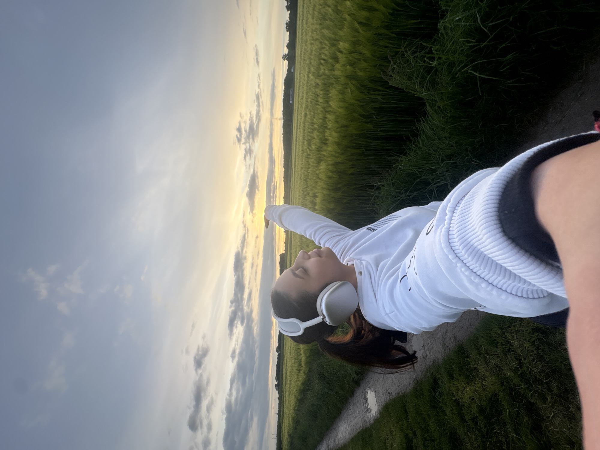 Person poses peacefully on countryside path near Mönchengladbach