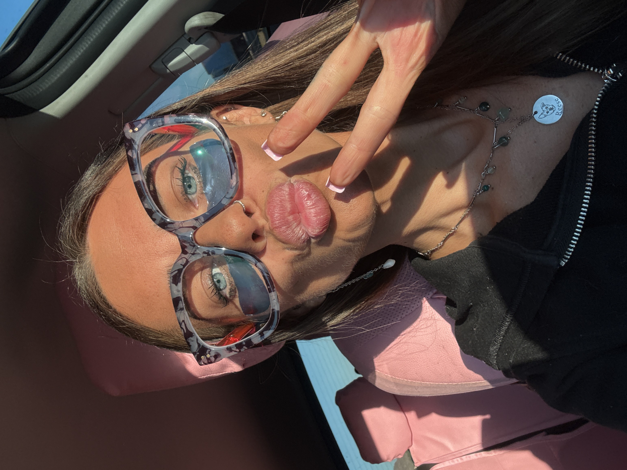 Selfie and desert views through a car window near Yermo