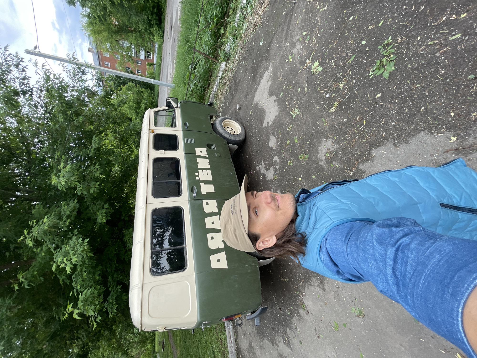 Woman films herself near vintage van in Izhevsk