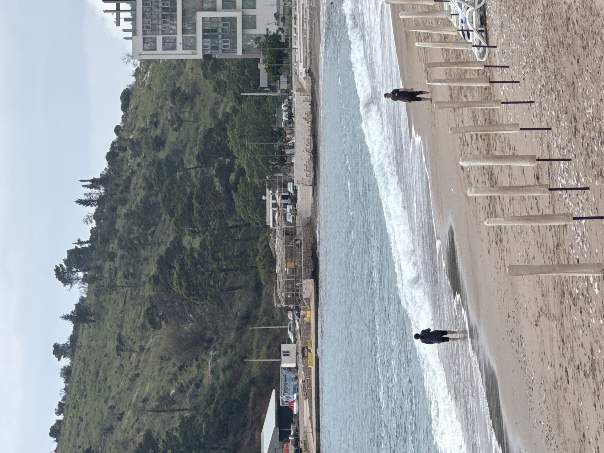 Beach activity observed in Miljevci, Montenegro under overcast skies